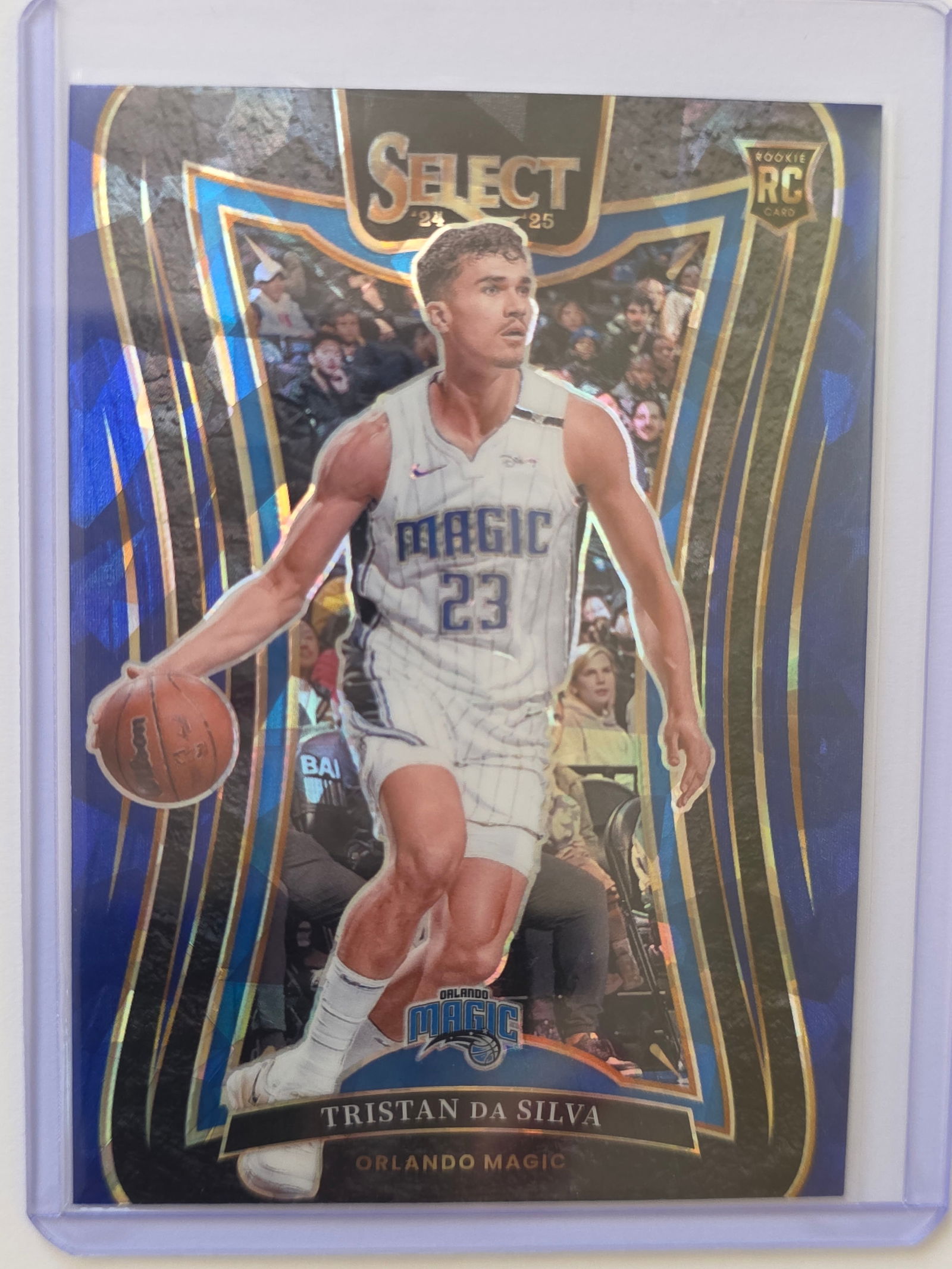 Tristan da Silva ROOKIE PRIZM 2024 Select Mezzanine Orlando Magic #380: 2024 Panini Select Tristan da Silva Mezzanine Level Rookie Prizm #380 for the Orlando Magic. Higher-tier Mezzanine insert with prizm finish. Stored in protective sleeve and holder. See photos for cent