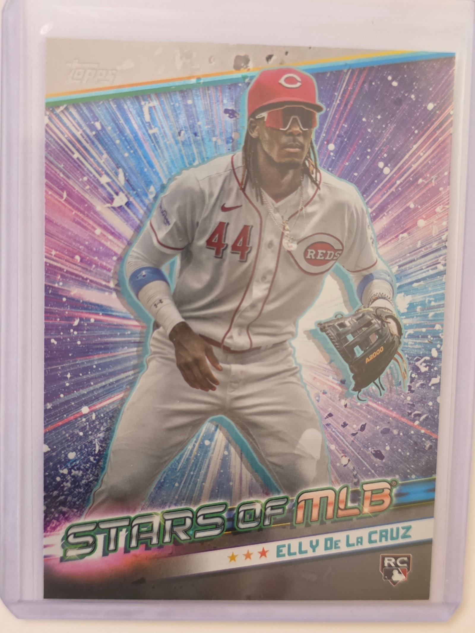 Elly De La Cruz ROOKIE Stars of MLB Reds Insert SMLB-23: 2024 Topps Elly De La Cruz rookie Stars of MLB insert card SMLB-23 featuring Cincinnati Reds shortstop. Bright insert design highlighting one of the top young players in the league. RC logo present. S