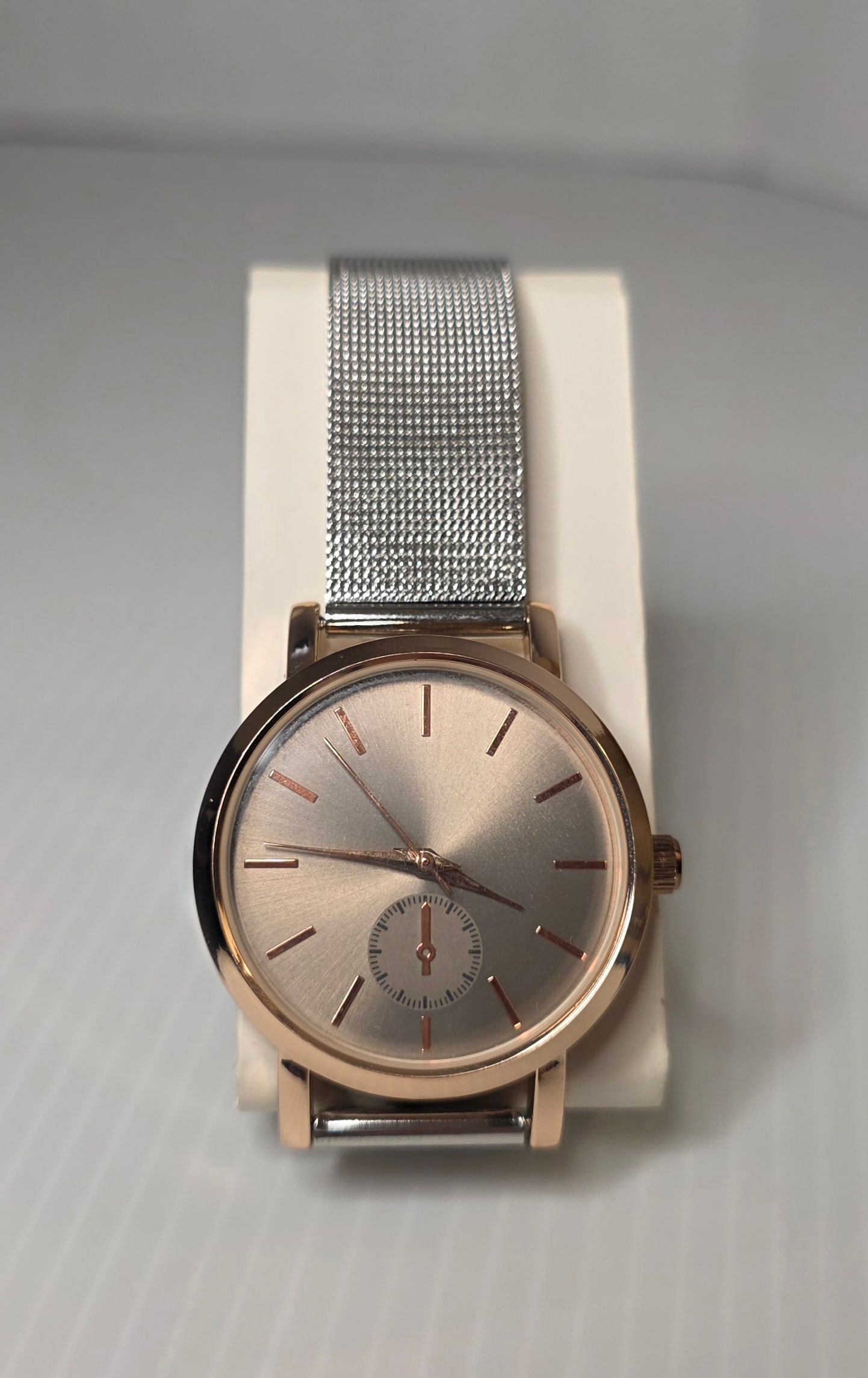 Rose Gold Tone Watch Mesh Band Japan Movement Stainless Back Minimalist: Unbranded analog wristwatch featuring a rose gold tone case with a silver tone stainless steel mesh band. The watch has a minimalist dial with a sub seconds style display.The case back is marked Base