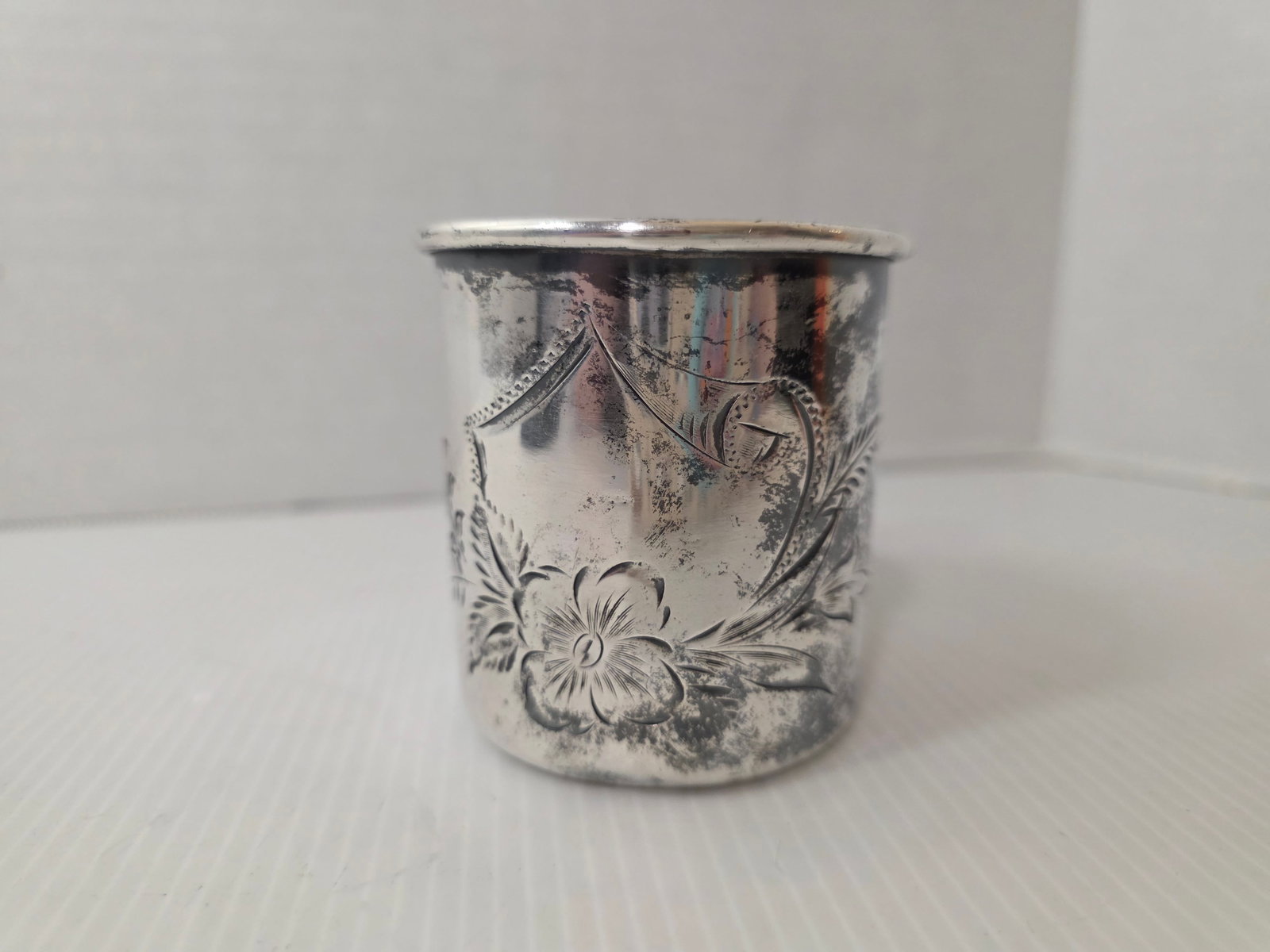 Antique Barbour Silver Co Creamer Quadruple Plate 112 Victorian: Antique Barbour Silver Company quadruple silverplate creamer, form number 112. The piece features floral engraved decoration with a small applied handle.The underside is stamped Barbour Silver Co Silv