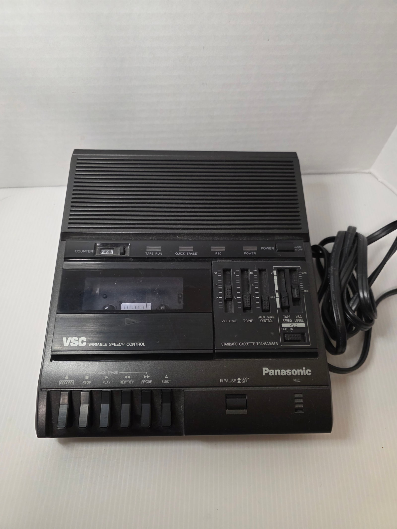 Panasonic RR-830 Cassette Transcriber Dictation Machine VSC: Panasonic RR-830 cassette transcriber dictation machine with Variable Speech Control for adjustable playback speed. The unit features cassette playback, tape counter, backspace control, and tone and v
