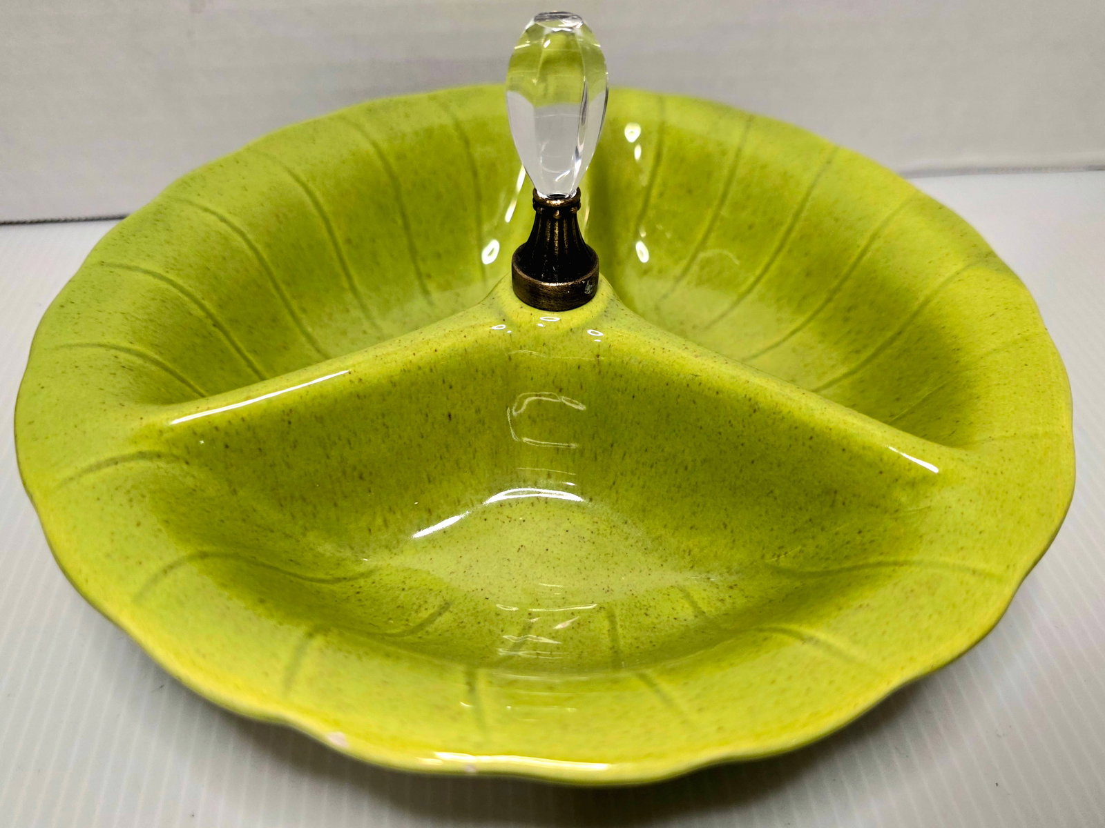 Vintage Lane & Co California Green Divided Relish Dish Crystal Handle 3007: Vintage Lane & Co California three section divided relish dish in bright green glaze with speckled finish. Features a center handle with clear acrylic/crystal style knob and metal base. Marked on unde