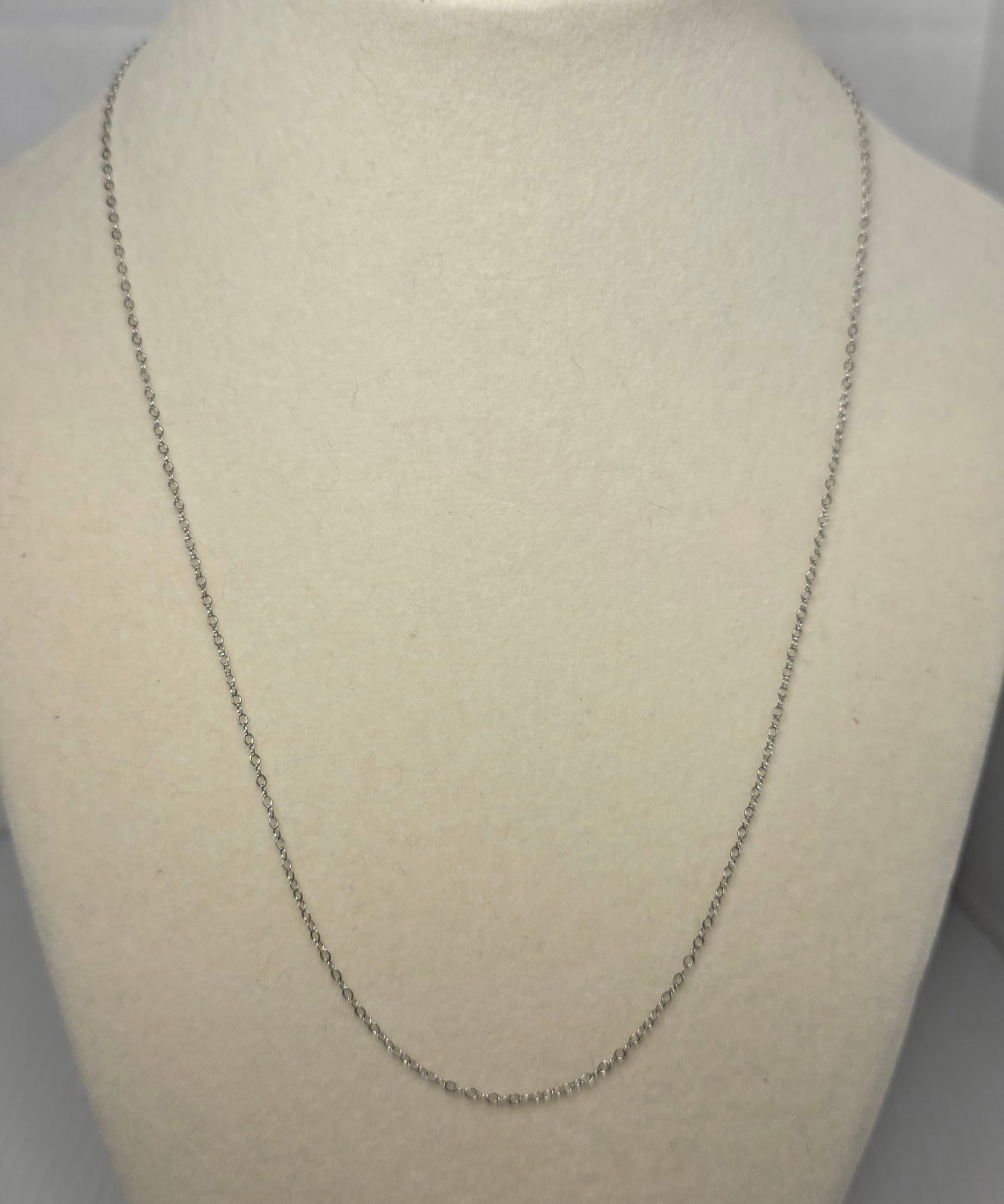 Sterling Silver Chain Necklace 18 Inch Fine Link Signed Clasp: Delicate sterling silver fine link chain necklace with a spring ring clasp marked Sterling.The chain has a minimalist design suitable for everyday wear, layering, or use with a pendant. The necklace m