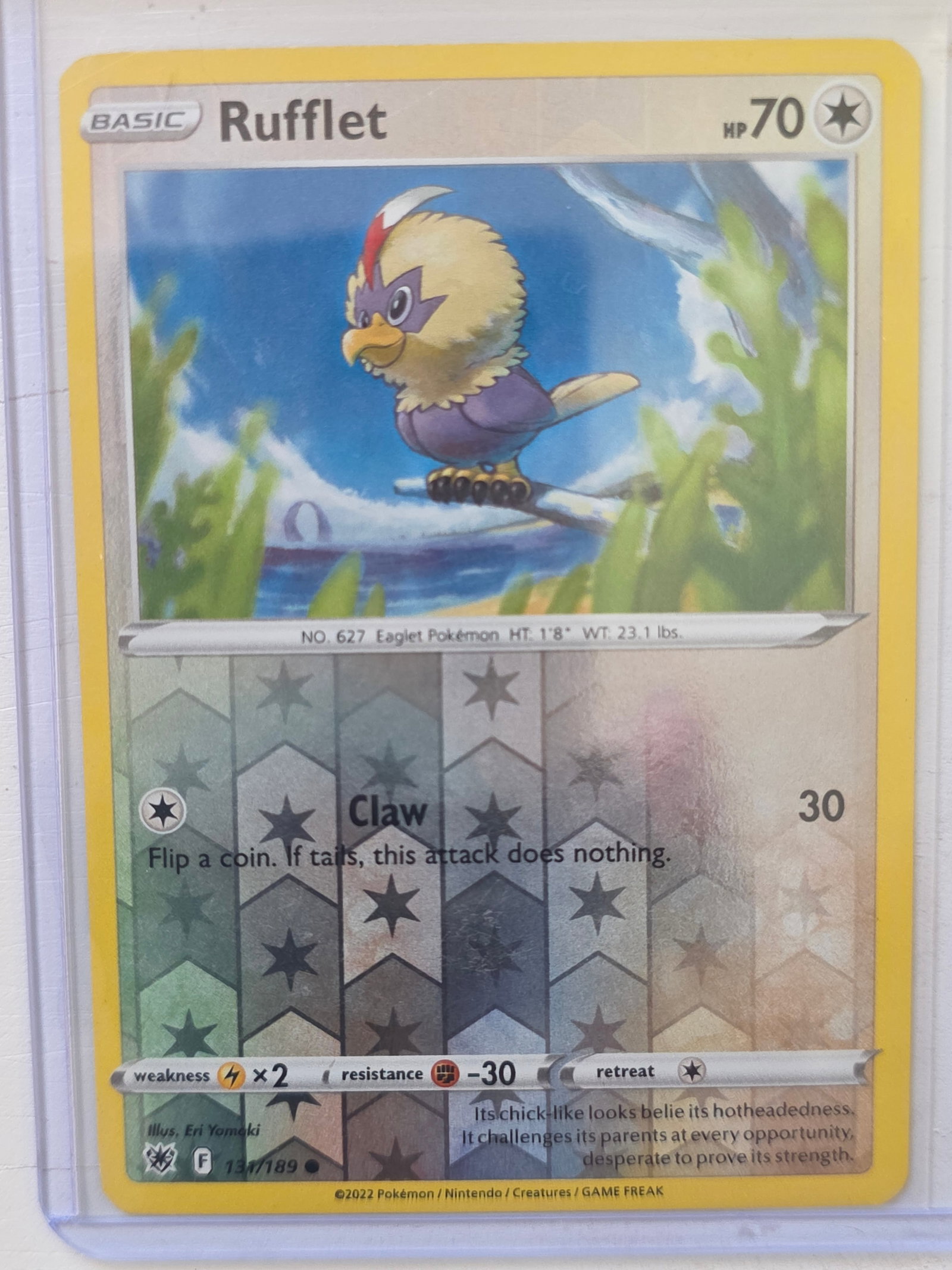 2022 Rufflet Astral Radiance 131/189 Reverse Holo: 2022 Rufflet Basic Colorless Pokemon. Astral Radiance set. Card number 131/189. HP 70. Attack Claw 30. Reverse holo pattern on card front. Preowned card stored in penny sleeve and top loader. Sold as