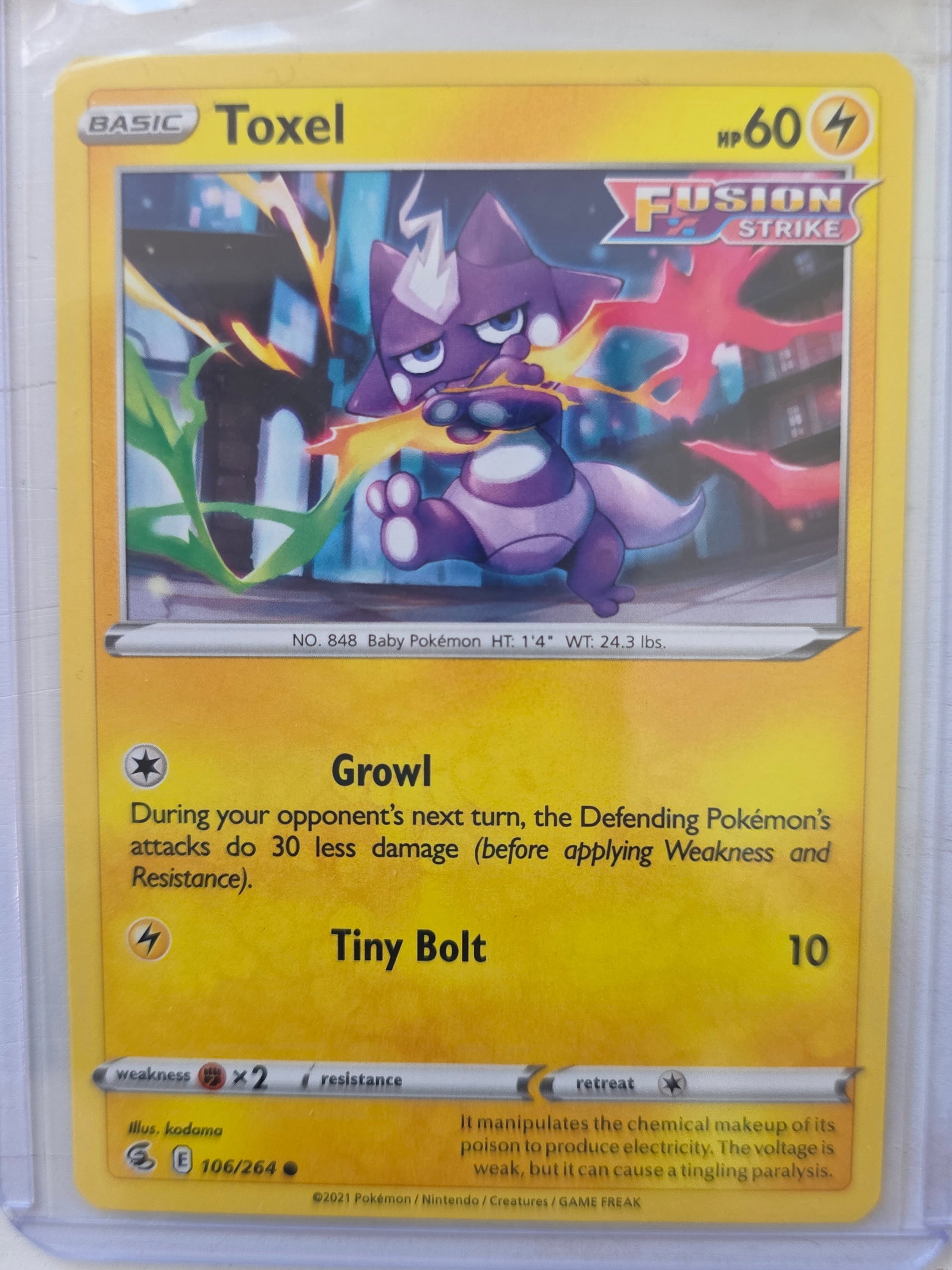 2021 Toxel Fusion Strike 106/264 Non Holo: 2021 Toxel Basic card 106/264 from Sword and Shield Fusion Strike. 60 HP Lightning type. Growl and Tiny Bolt 10. Non holo card. Preowned and stored in penny sleeve and top loader. Sold as shown.