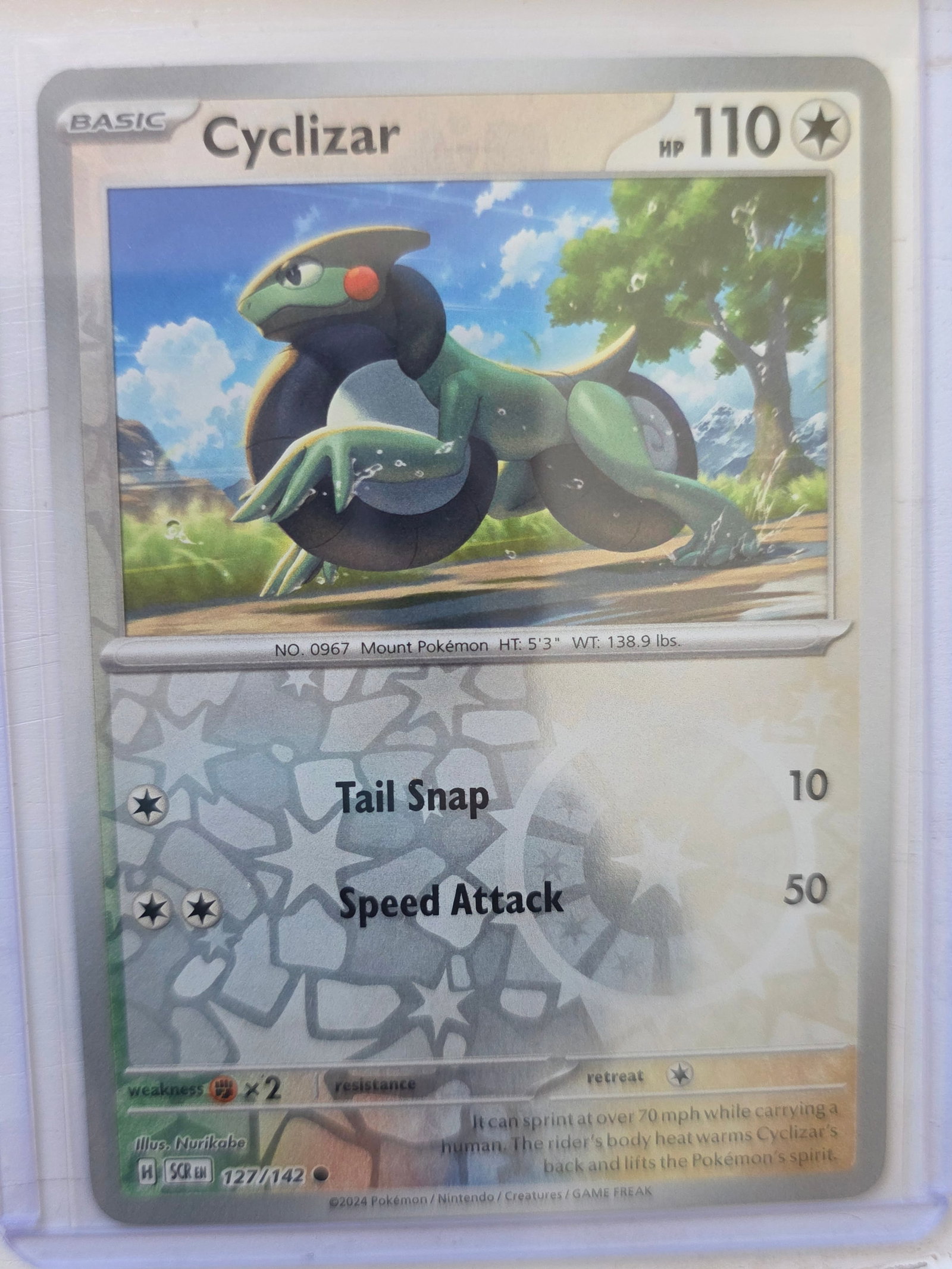 2024 Cyclizar Stellar Crown 127/142 Reverse Holo Pokemon Card: 2024 Pokemon Cyclizar reverse holo card numbered 127/142 from the Scarlet & Violet Stellar Crown expansion set. Basic Colorless-type Pokemon illustrated by Nurikabe. Reverse holographic foil pattern a