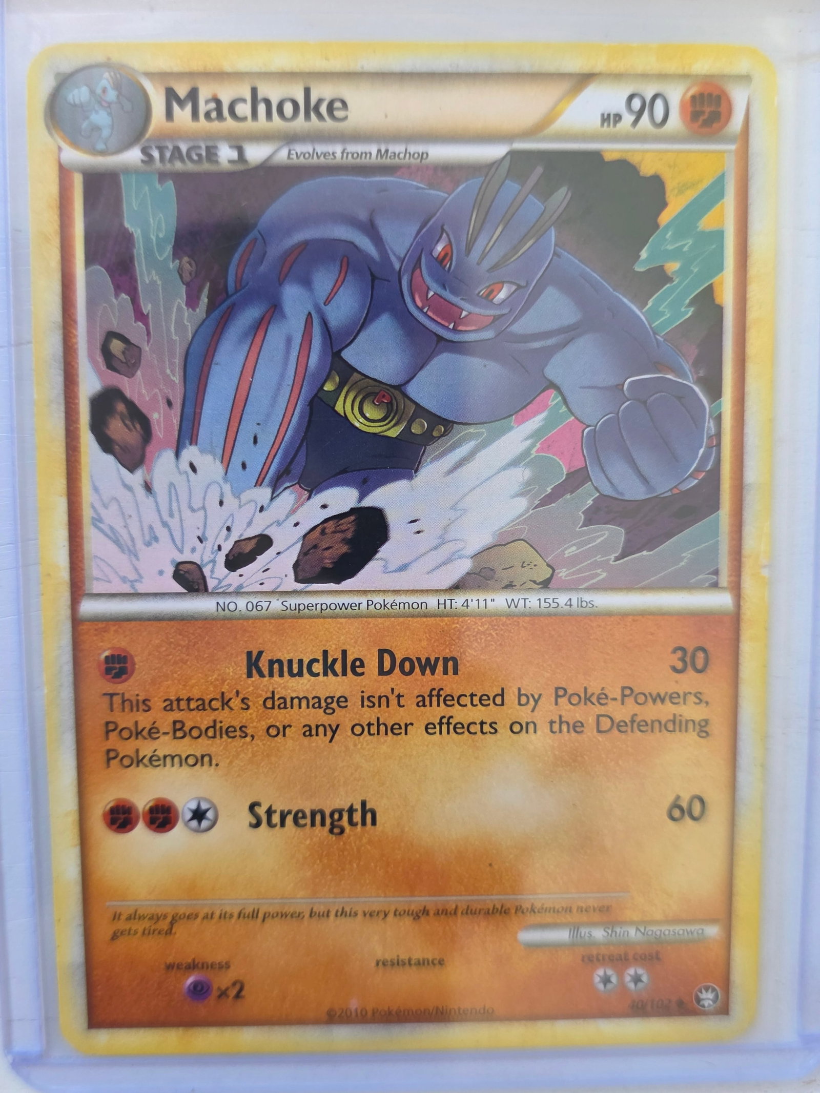 2010 Machoke Triumphant 40/103 Pokemon Card: 2010 Pokemon Machoke card numbered 40/103 from the HeartGold & SoulSilver Triumphant expansion set. Illustrated by Shin Nagasawa. Card stored in penny sleeve and top loader.