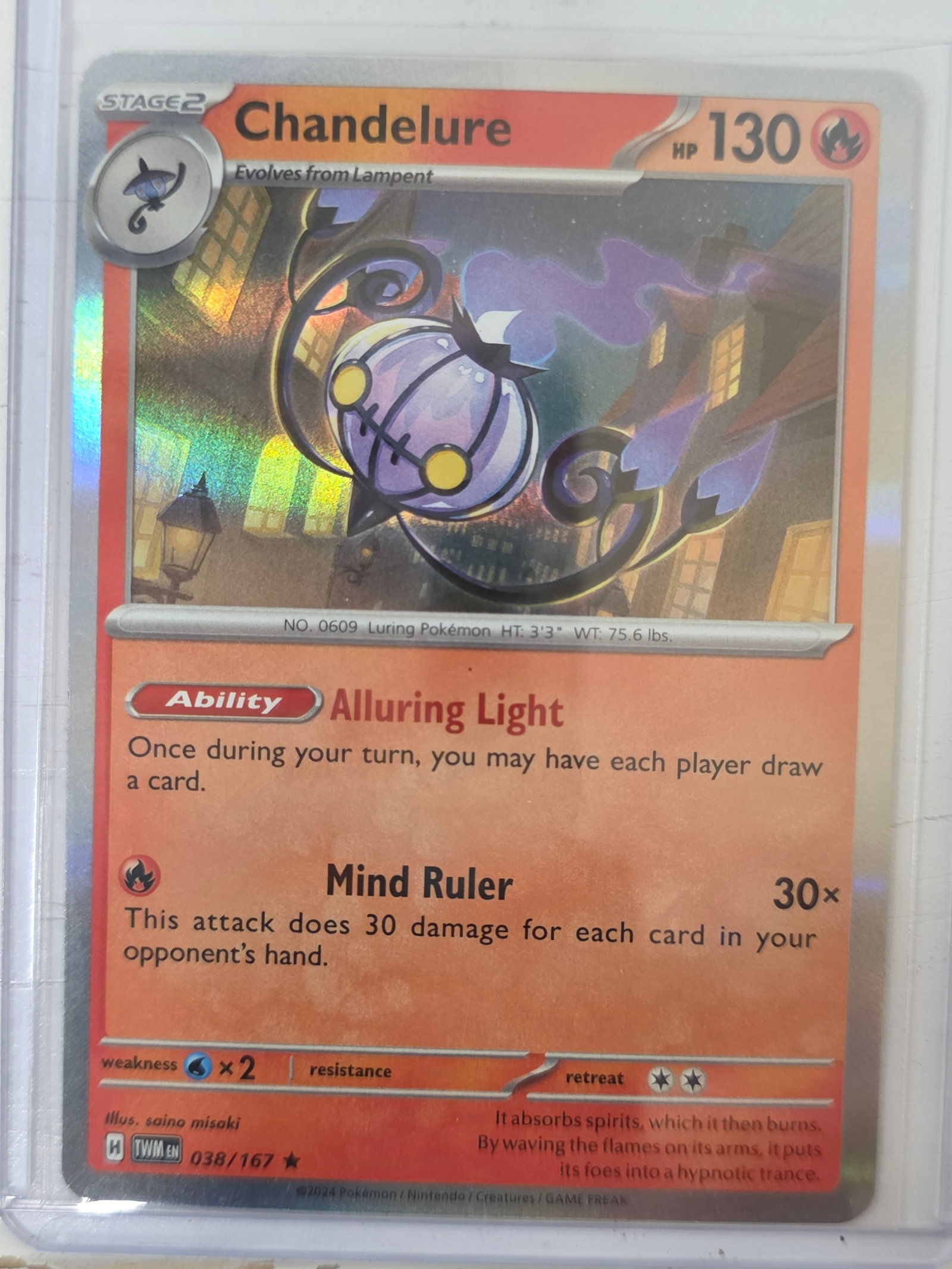 2024 Chandelure Twilight Masquerade 038/167 Holo Pokemon Card: 2024 Pokemon Chandelure holographic card numbered 038/167 from the Scarlet & Violet Twilight Masquerade expansion set. Illustrated by saino misaki. Standard holographic finish across the illustration