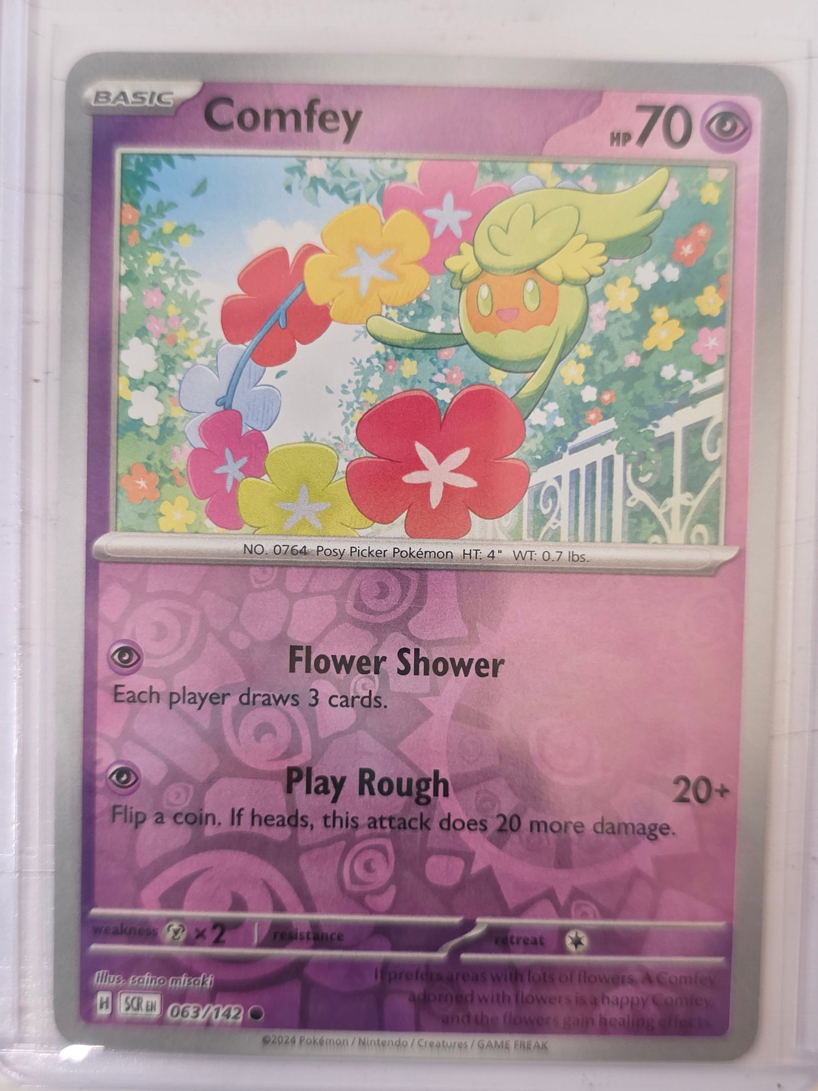 2024 Comfey Stellar Crown 063/142: 2024 Pokemon Comfey card numbered 063/142 from the Scarlet & Violet Stellar Crown expansion set. Card stored in penny sleeve and top loader.