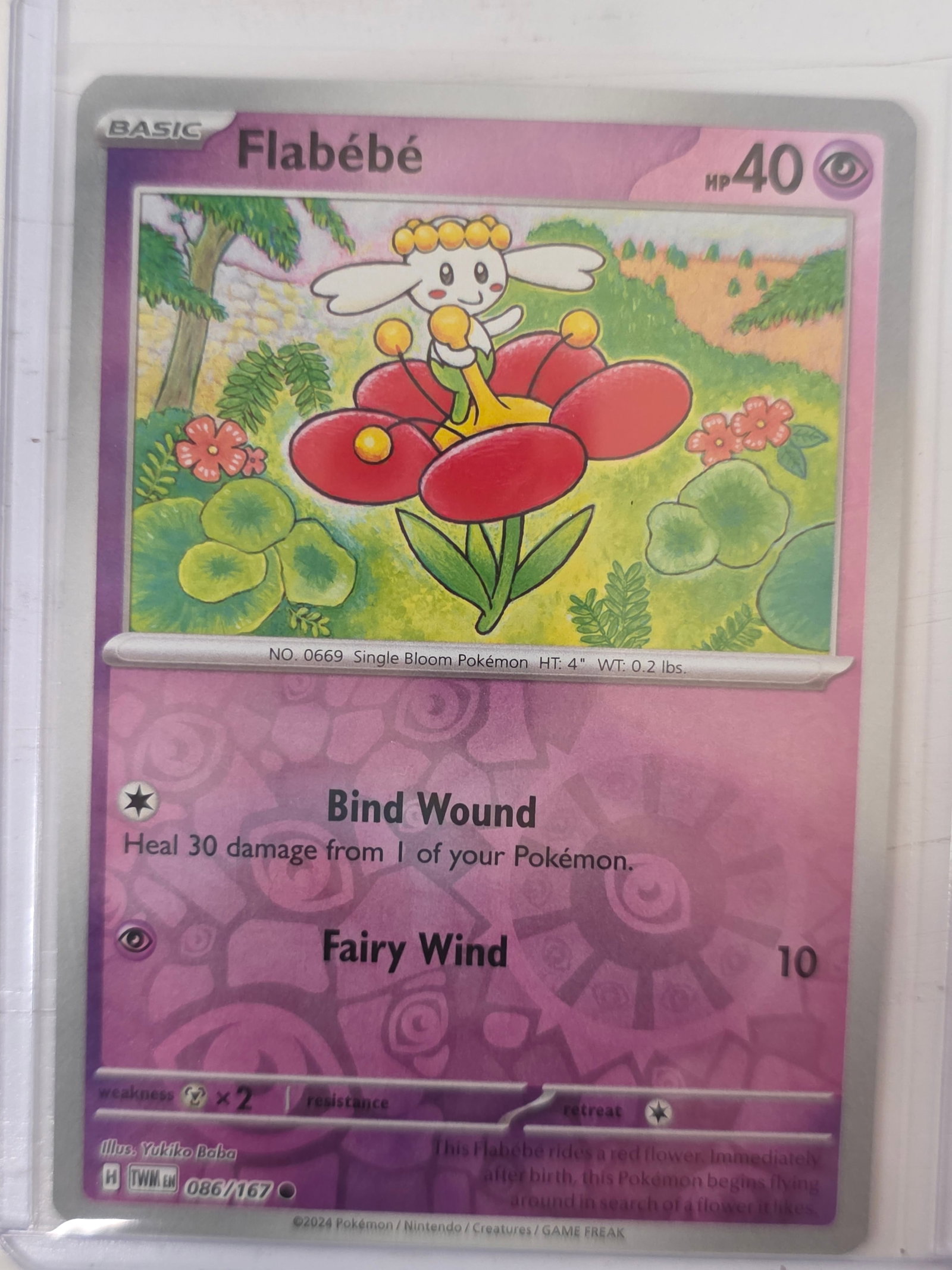 2024 Flabebe Temporal Forces 086/167 Reverse Holo Pokemon Card: 2024 Pokemon Flabebe card from the Temporal Forces set numbered 086/167. Reverse holo card stored in penny sleeve and top loader.