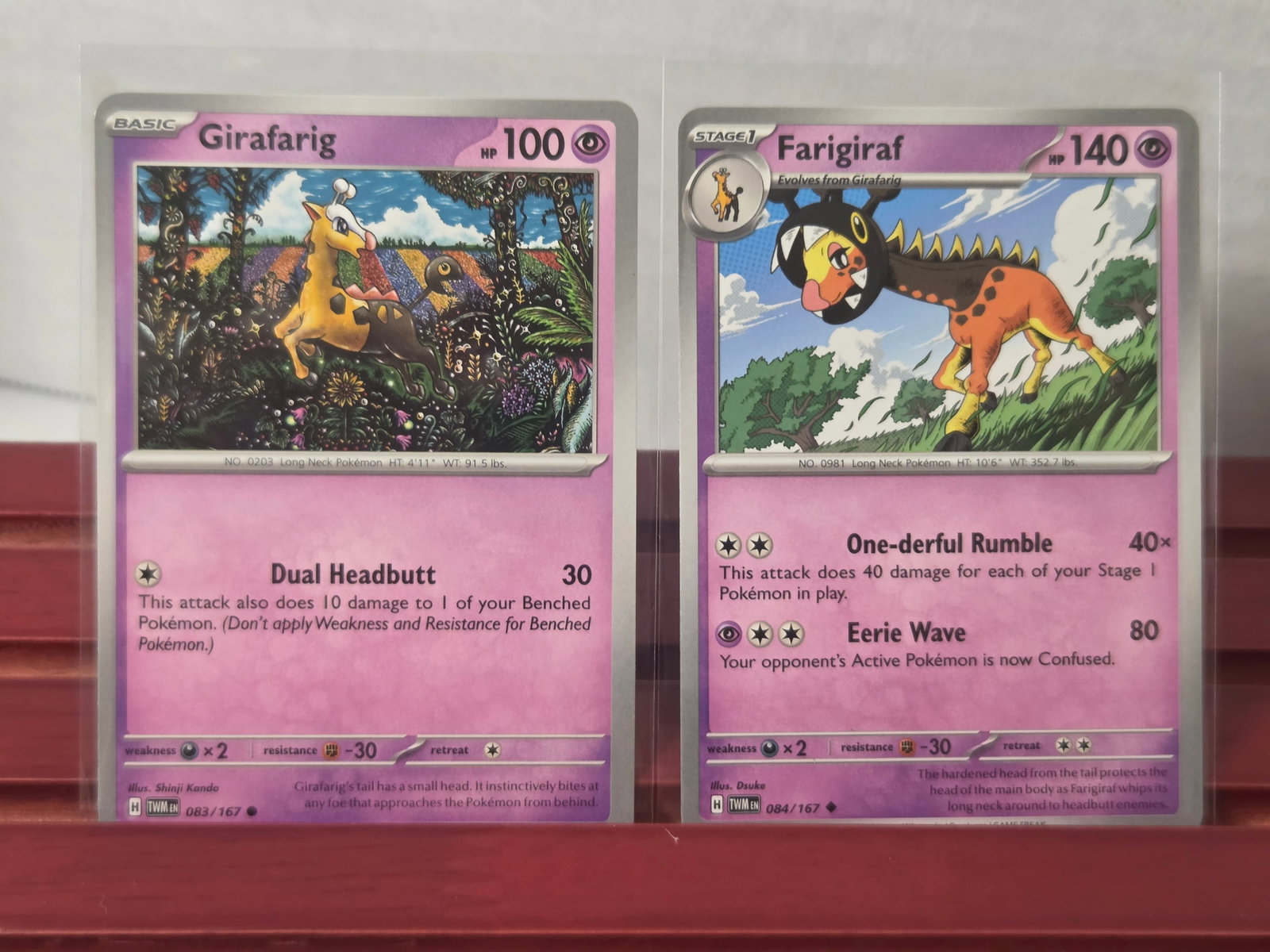 2024 Girafarig 083/167 Farigiraf 084/167 Pokemon Card Lot: Preowned lot of 2 Pokemon cards including Girafarig 083/167 and Farigiraf 084/167 from the same set. Evolution pair featuring matching artwork style. Stored in penny sleeves and top loaders. Clean ove