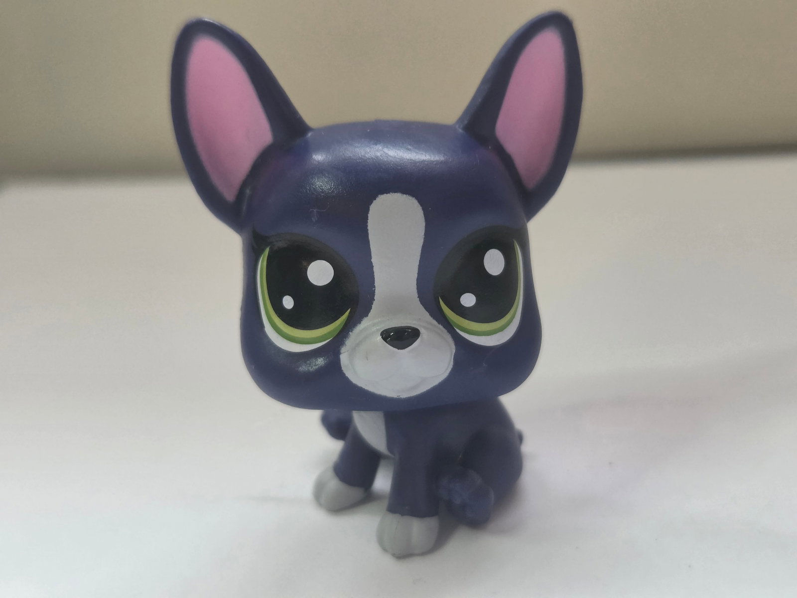 GEN 4 Boston Terrier Abner Keep Me Pets Fancy Pet Salon Purple Dog: This Littlest Pet Shop Boston Terrier, known as Abner, comes from Hasbro’s Keep Me Pets Fancy Pet Salon Wave 1 series. It features a deep purple body with white facial markings and bright green eyes