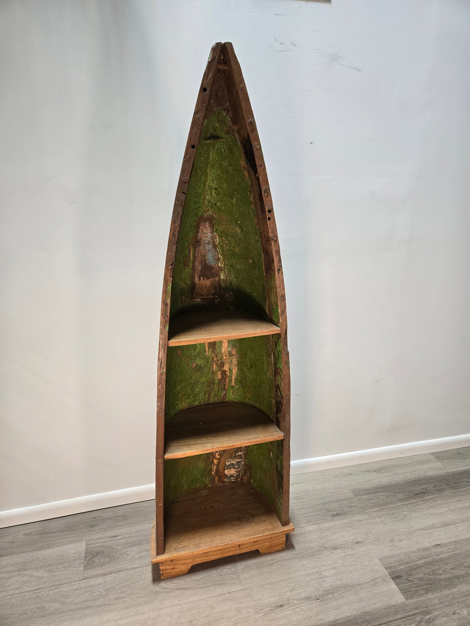 Teak Boat Canoe Cabinet: Authentic Teak Boat Wood Canoe CabinetHandmade in Java, Indonesia using half of an actual fishing canoe.Shelf is brand new.Approximate Dimensions:Height: 70.5"Width: 22.5"Depth: 14"Perfect for Indoor