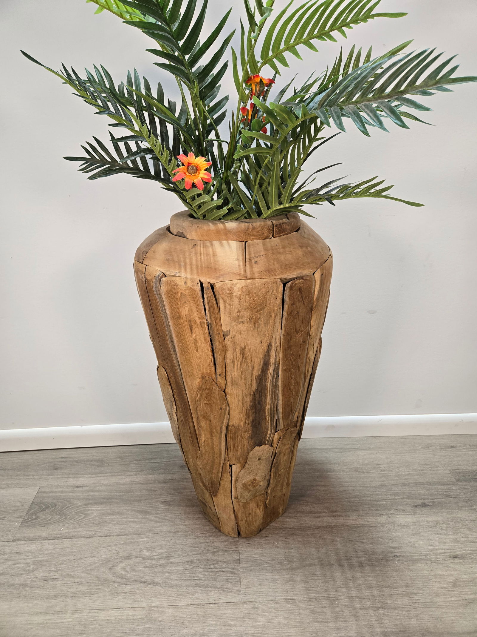 Teak Floor Vase: Teak Floor PlanterThis unique floor planter was handcrafted in Java, Indonesia using sustainably harvested teak wood.Planter is brand new.Dimensions (approximate) :Height: 32"Total Diameter: