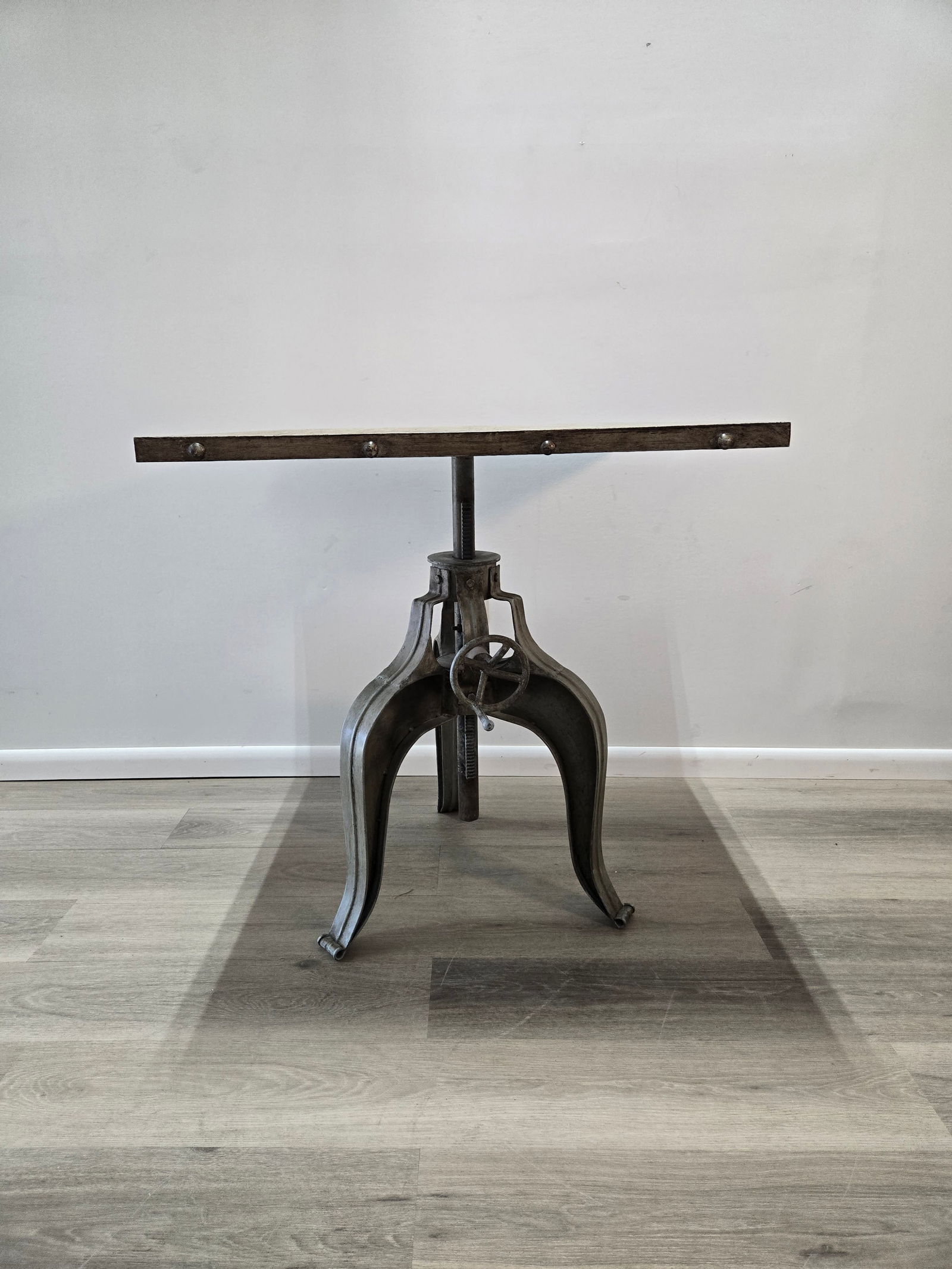 Adjustable Crank Table - Square Top: Adjustable Crank Table - Square TopThis unique, industrial dining table features an adjustable metal crank base and removable, square metal top.This piece is brand new, although there is a very