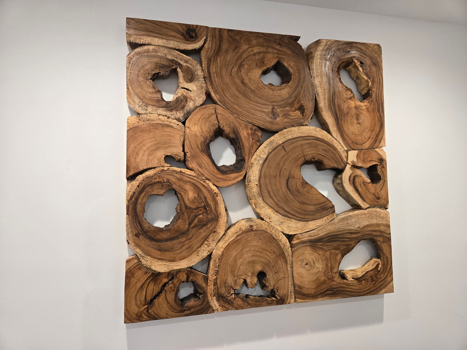 Large Suar Wood Wall Art: Large Suar Wood Wall ArtThis unique wall art piece was hand-crafted from 100% natural, sustainably harvested Suar wood.Piece is brand new.Approximate Dimensions - Height: 47"Width: 47"Depth: 2.25"*