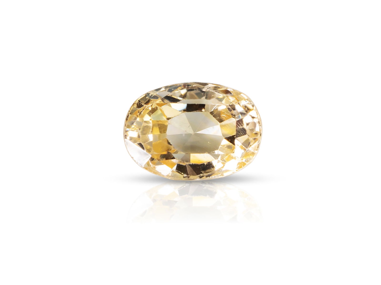 Light yellow oval sapphire weighing 4.77 carats: Light yellow oval sapphire weighing 4.77 caratsLight yellow, oval faceted sapphire, 10.52 x 7.57 x 5.78, weight 4.77 carats.