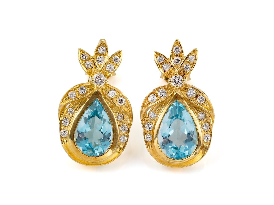 Topaz and Diamond Stud Earrings in 14k Yellow Gold: Topaz and Diamond Stud Earrings in 14k Yellow GoldCharming stud earrings in yellow gold, hallmarked 585 on the backs. Set in the earrings are two topazes (approximately 10 x 7 mm, treated) totaling ap