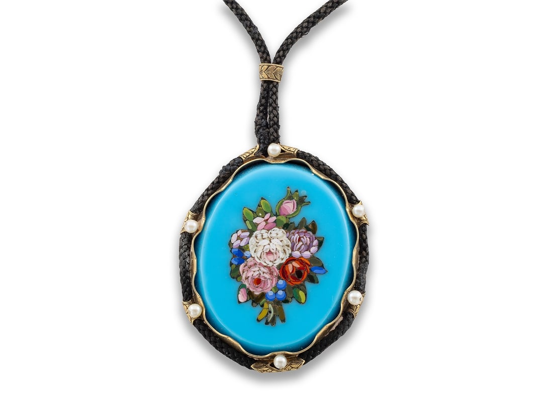 Floral antique micro mosaic in yellow gold, with small pearls on a cord chain.: Floral antique micro mosaic in yellow gold, with small pearls on a cord chain.Floral micro mosaic (circa 3rd quarter of the 19th century) with flowers on a blue background, set in yellow gold, not hal