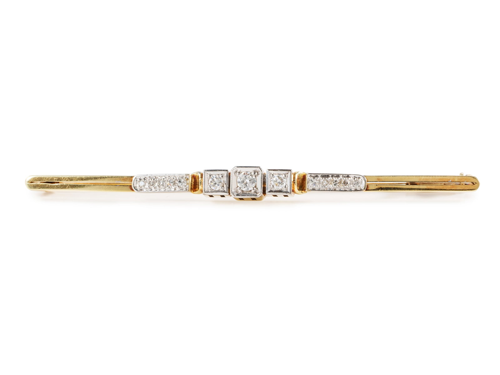 Diamond pin in 14k yellow and white gold: Diamond pin in 14k yellow and white goldA distinctive pin in yellow and white gold, hallmarked 585. Set in the pin are 3 brilliant-cut diamonds and 10 eight-cut diamonds (medium color and high clarity