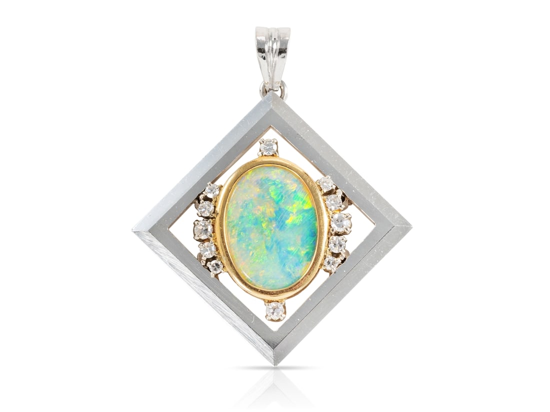 Exquisite opal and diamond pendant in 750 white gold and yellow gold: Exquisite opal and diamond pendant in 750 white gold and yellow goldExquisite pendant made of white gold and yellow gold, hallmarked 750. The pendant is set with a colourful opal (approx. 15.3 x 10.9