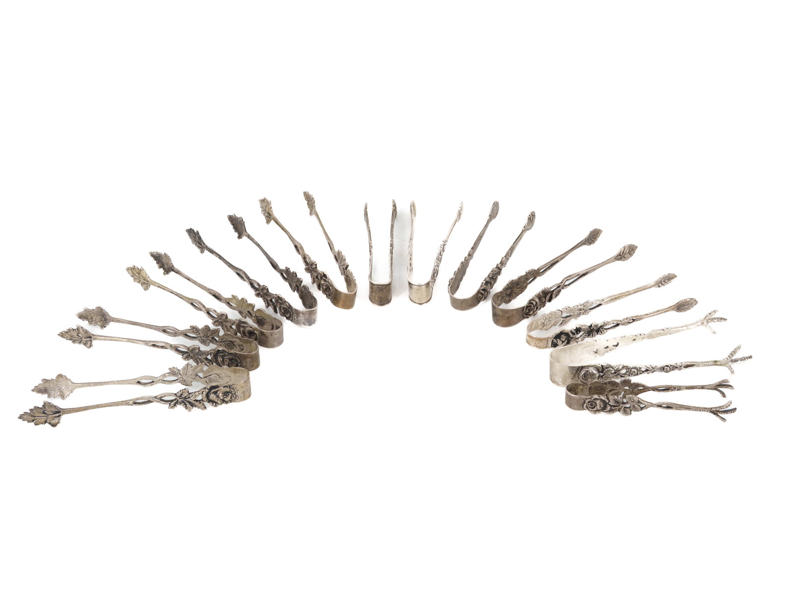 12 sugar tongs made of 800 silver, circa 1900: 12 sugar tongs made of 800 silver, circa 1900Set of twelve sugar tongs, 800 silver, circa 1900. The tongs feature predominantly floral decorations in the style of the Hildesheim rose. Finely crafted
