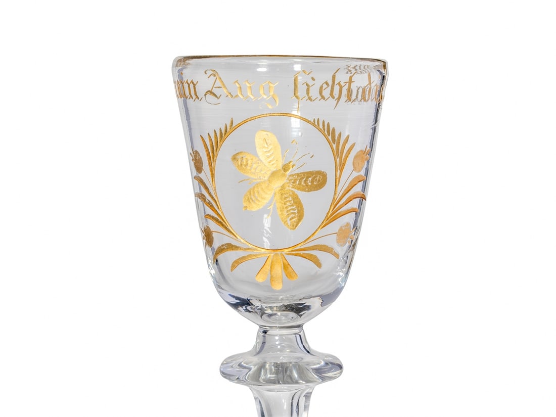 Baroque chalice glass ‘Bee’, mid-18th century: Baroque chalice glass ‘Bee’, mid-18th centuryBaroque chalice glass with slightly conical bowl and rich gold decoration. On the front, a bee is depicted in a floral cartouche, above which i