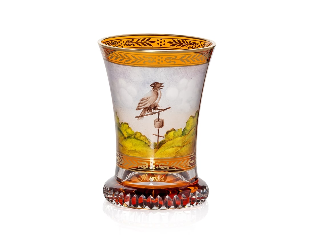 Cup with a bird in a landscape, circa 1850: Cup with a bird in a landscape, circa 1850Cup with a gilt rim and ornamentally framed image. The conical, upward-curving body rests on a round base with a yellow-glazed star on the bottom and a jagged