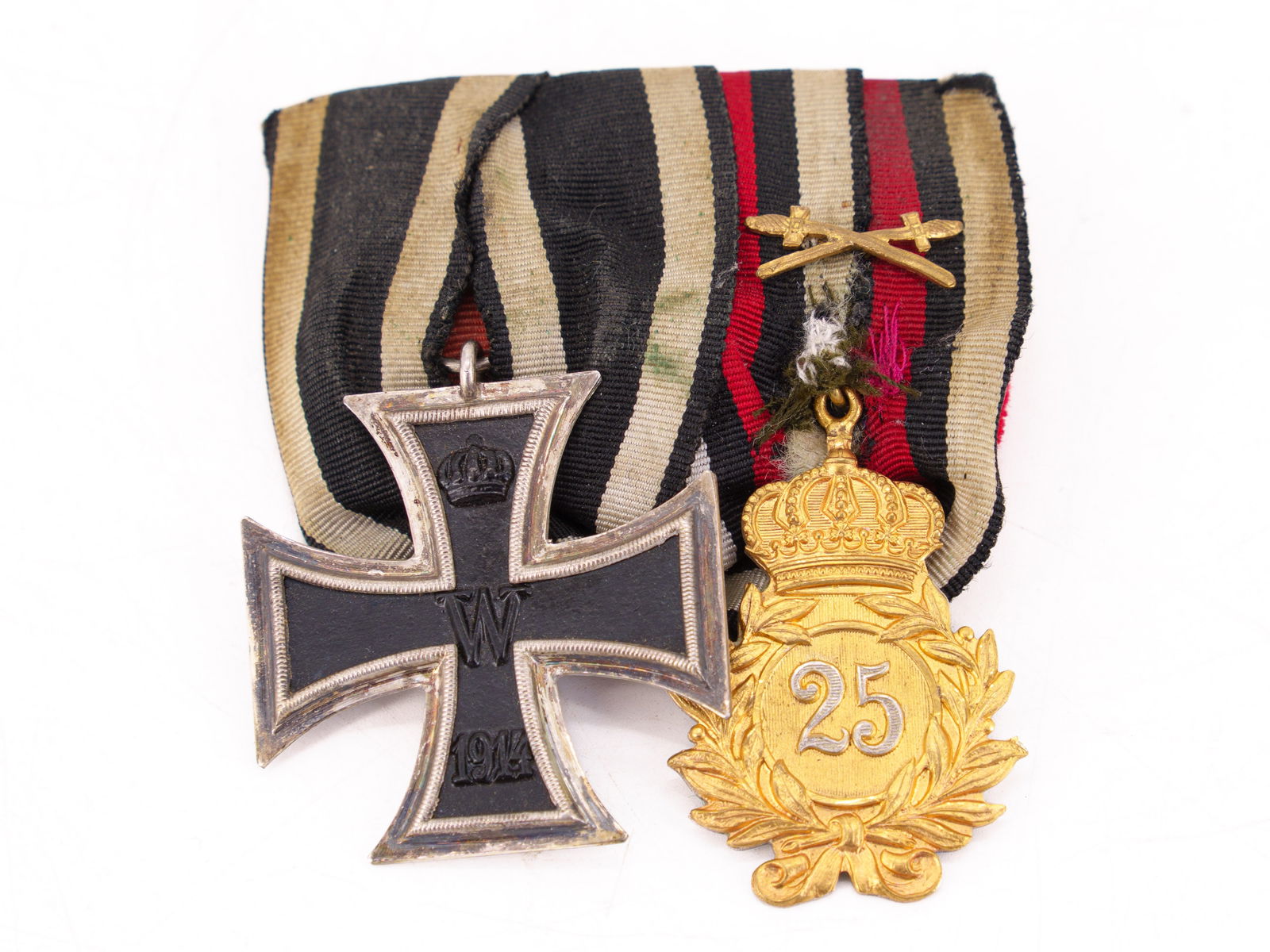 Iron Cross 2nd Class 1914 and anniversary badge: Iron Cross 2nd Class 1914 and anniversary badgeIron Cross 2nd Class for combatants in the First World War, 1914 version, and a ‘25’ anniversary badge. Both on ribbon, sewn onto red fabric