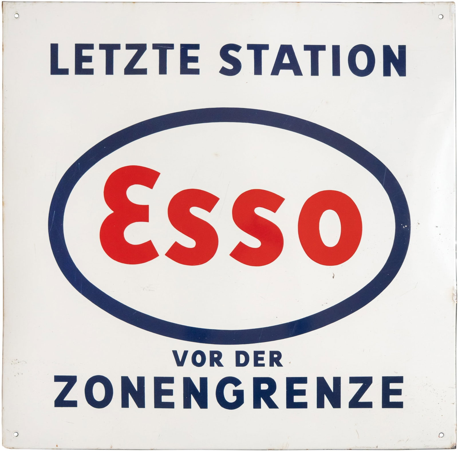 Esso enamel sign ‘Last stop before the zone border’, circa 1950 (2): Esso enamel sign ‘Last stop before the zone border’, circa 1950 (2)Esso enamel sign ‘Last stop before the zone border’, flat, bevelled, stenciled enamel. Very good gloss and rich red colour, s