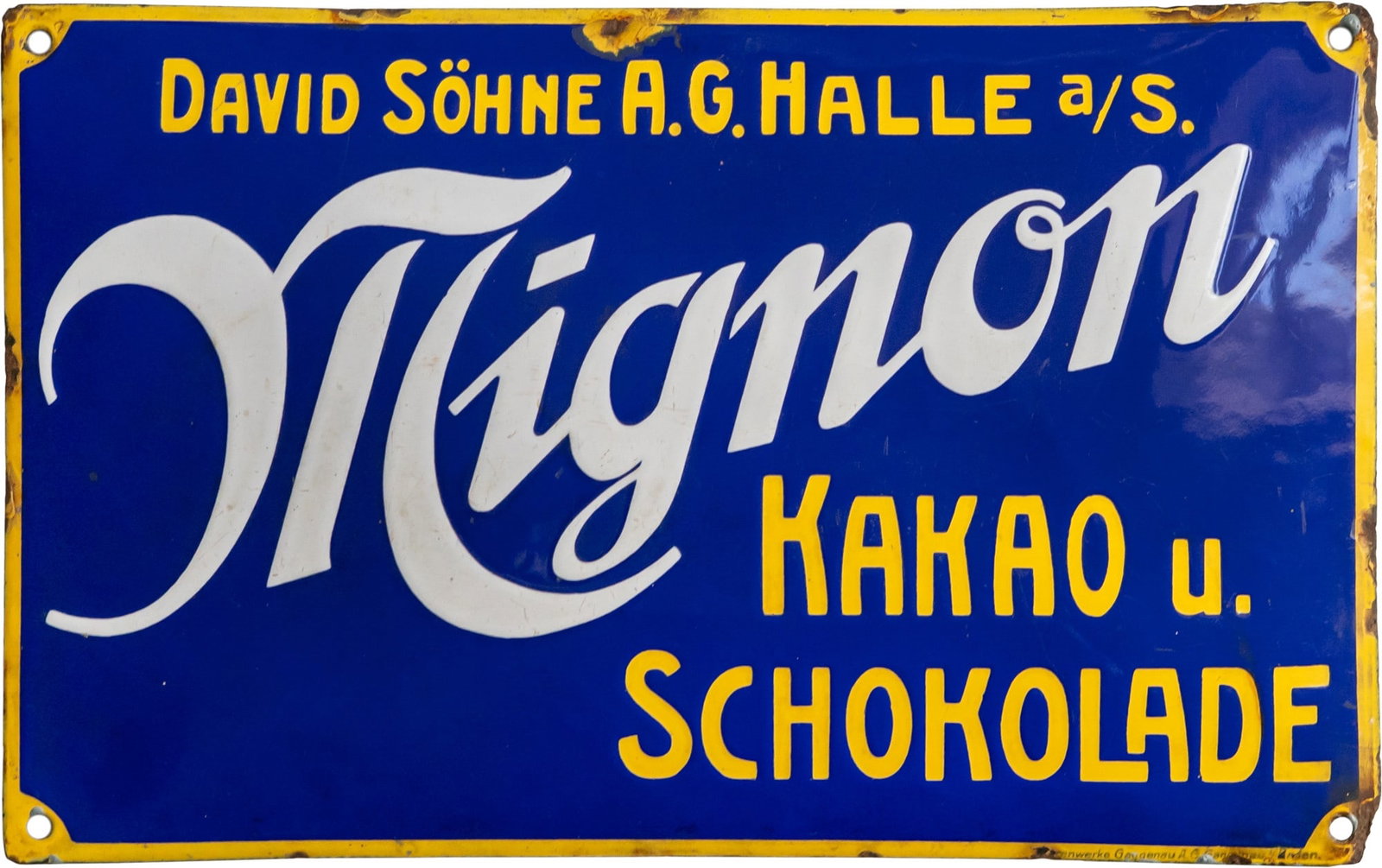 Mignon Cocoa and Chocolate enamel sign, Halle a/S, c. 1910 (2+): Mignon Cocoa and Chocolate enamel sign, Halle a/S, c. 1910 (2+)Mignon Cocoa and Chocolate enamel sign, domed, stenciled enamel work. Very good lustre, bright blue, slight superficial scratches. Marked