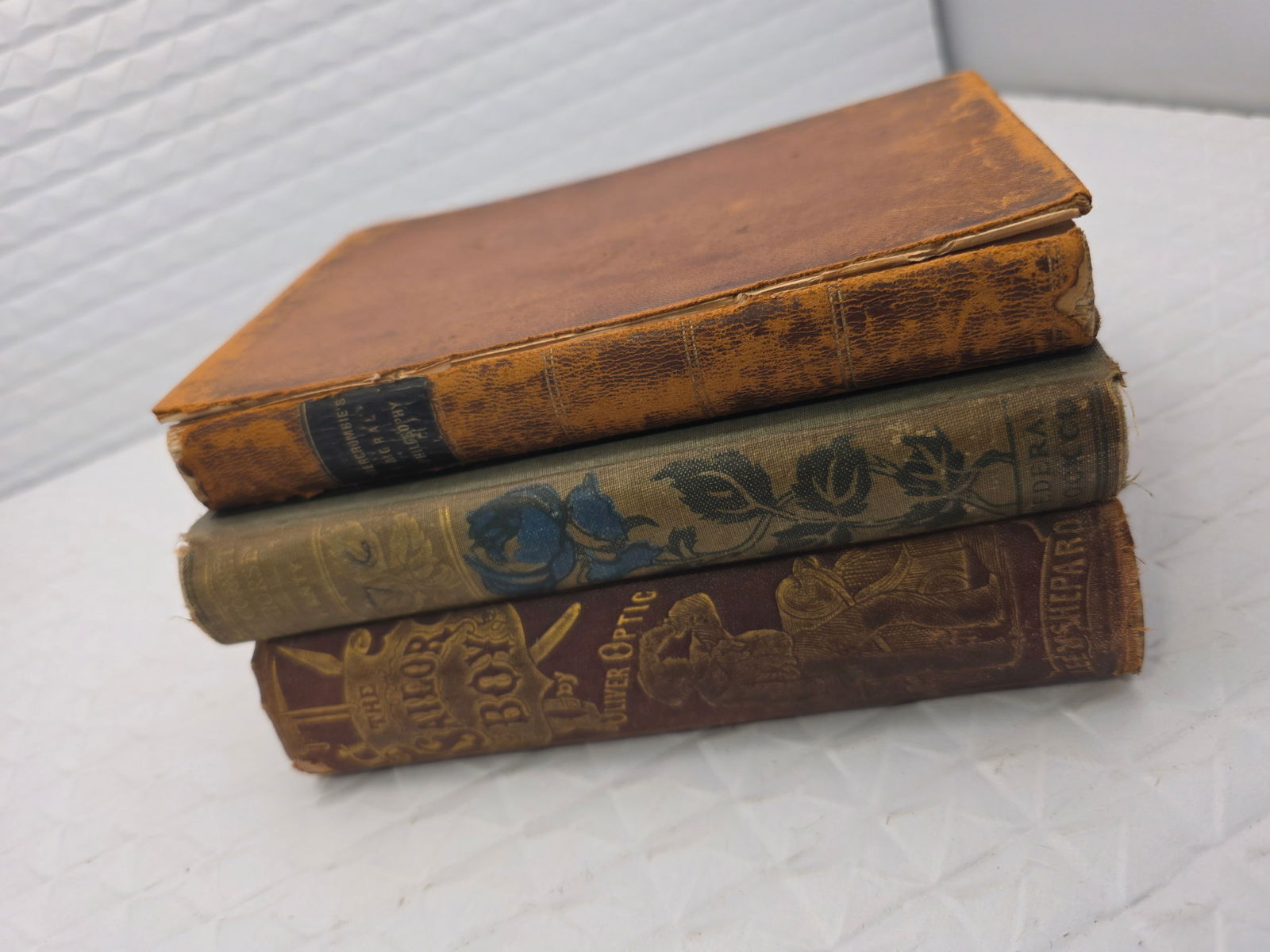 Collection of 3 antique books, one is by Oliver Optic: Minor condition issues, foxing, please check photosWhile we strive to note any damage, repairs, or restorations, please note that not all wear may be mentioned. All items are sold as-is. As these piec