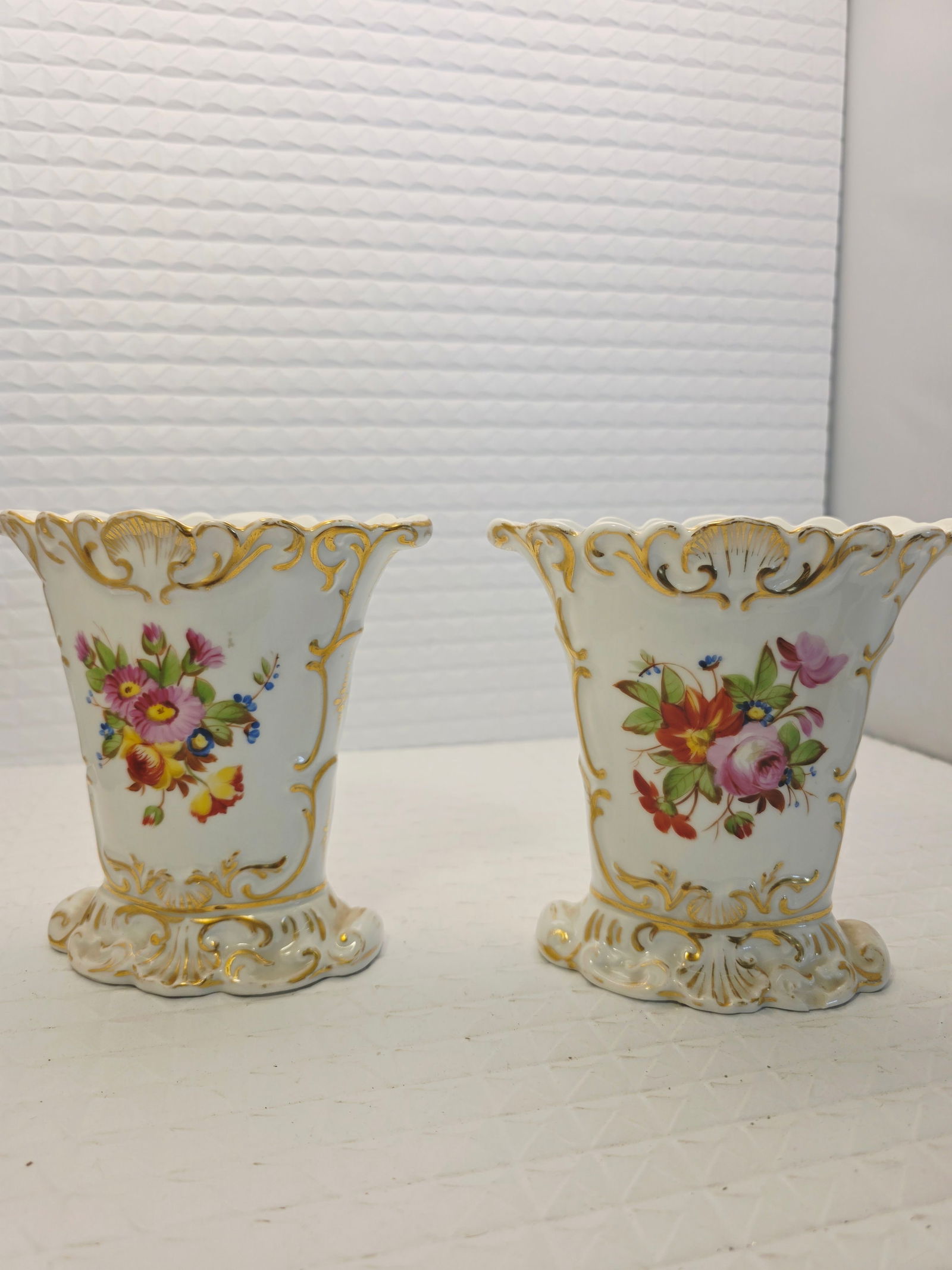 2 antique Vieux Paris porcelain vases: antique porcelain vases are likely 19th-century French "Old Paris" (Vieux Paris) porcelain spill vases. They are characterized by a Rococo Revival style, often featuring gilt (gold) accents and hand-p