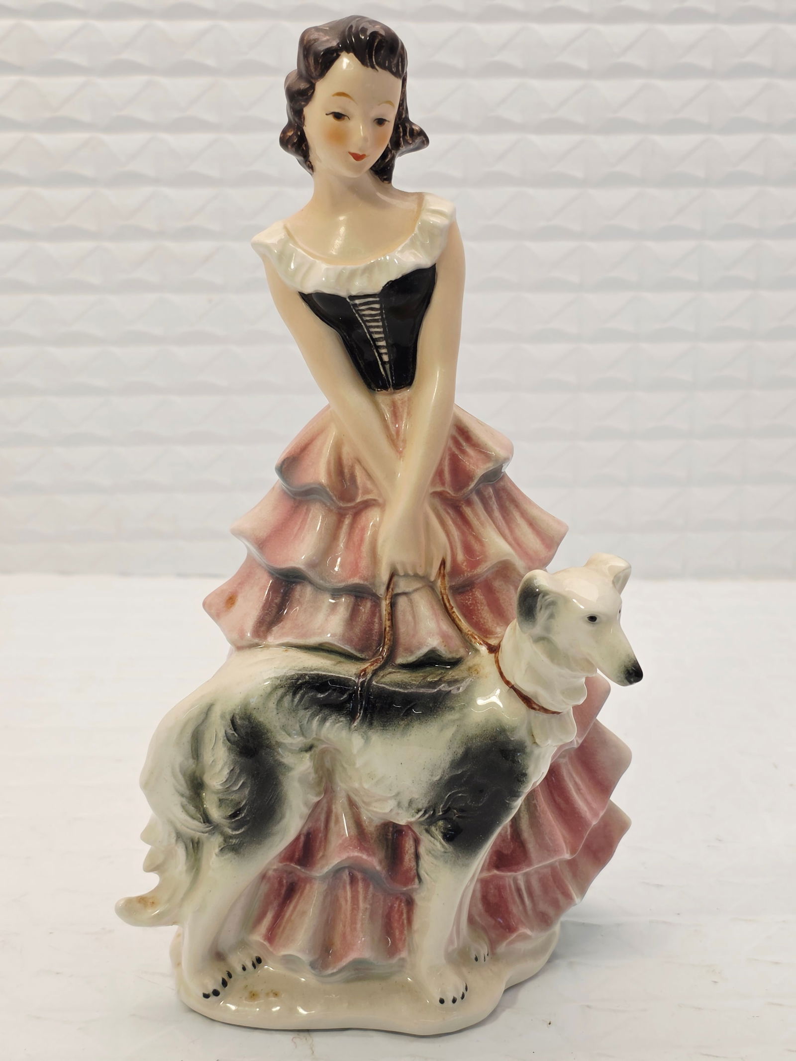 Rare Goebel figurine model #FF275: vintage porcelain figurine produced by the German company Goebel, featuring a lady dressed in a ruffled gown with a Borzoi dog. Model/Markings: It is identified as model #FF275 from the "Ladies of Fas