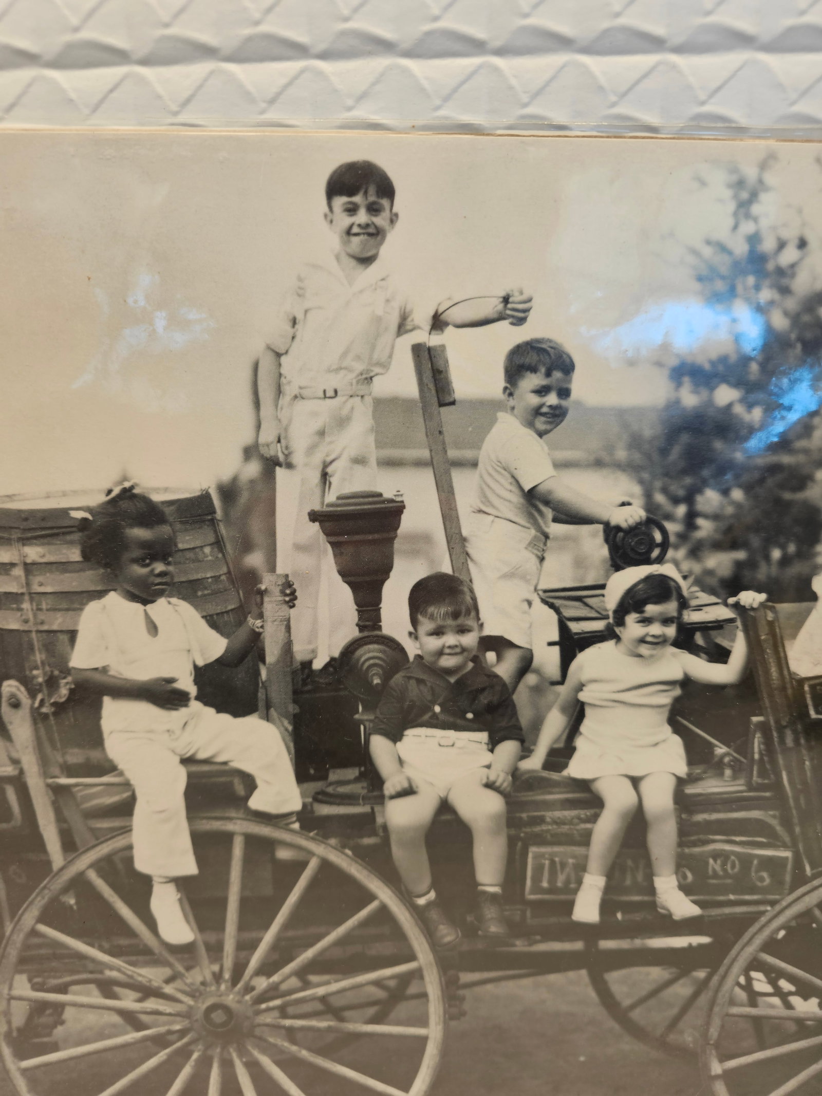 production still from the classic movie series "Our Gang," also widely known as "The Little: This vintage photograph appears to capture a scene from the classic movie series "Our Gang," also widely known as "The Little Rascals".