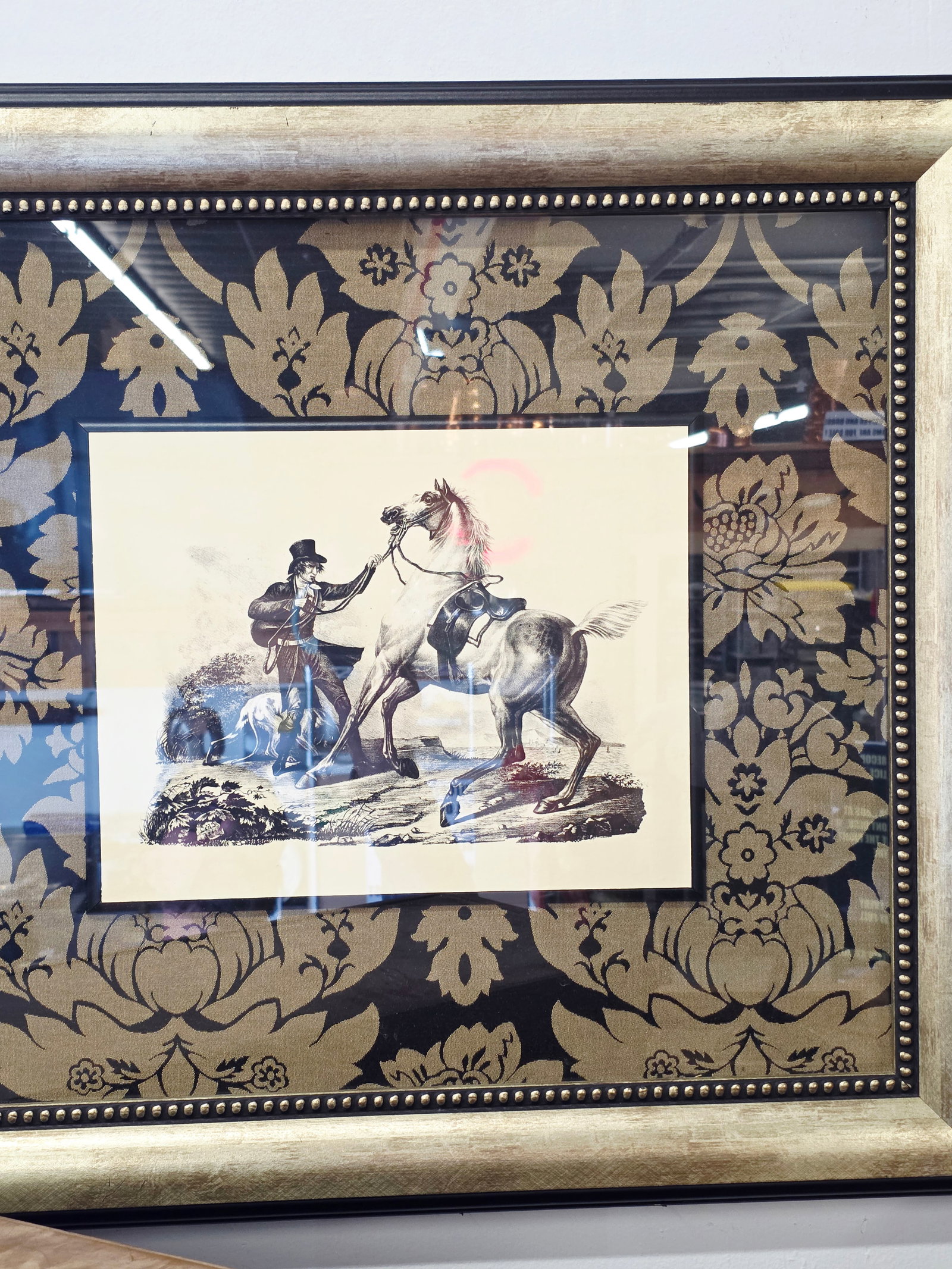 Newer Nicely framed Western themed print: Nicely framed newer decorative print featuring a Western-style scene of a cowboy with his horsE. The print is housed within an ornate gilded frame, Victorian or antique-style decorative art.