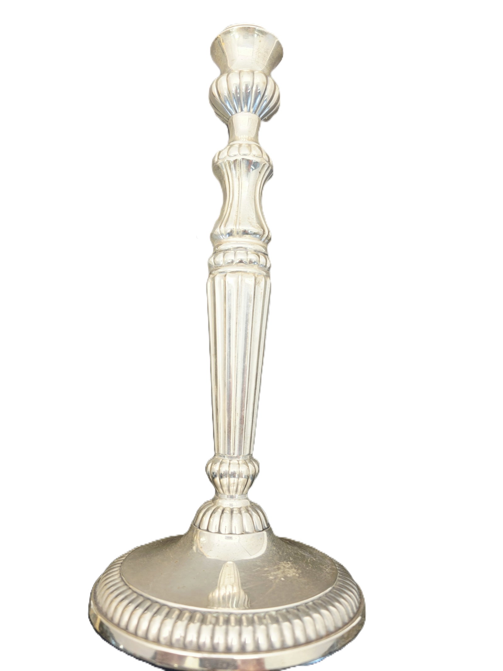 silver toned candlestick featuring neoclassical Adams-style vertical fluted: This is a silver toned candlestick featuring neoclassical Adams-style vertical fluted decoration