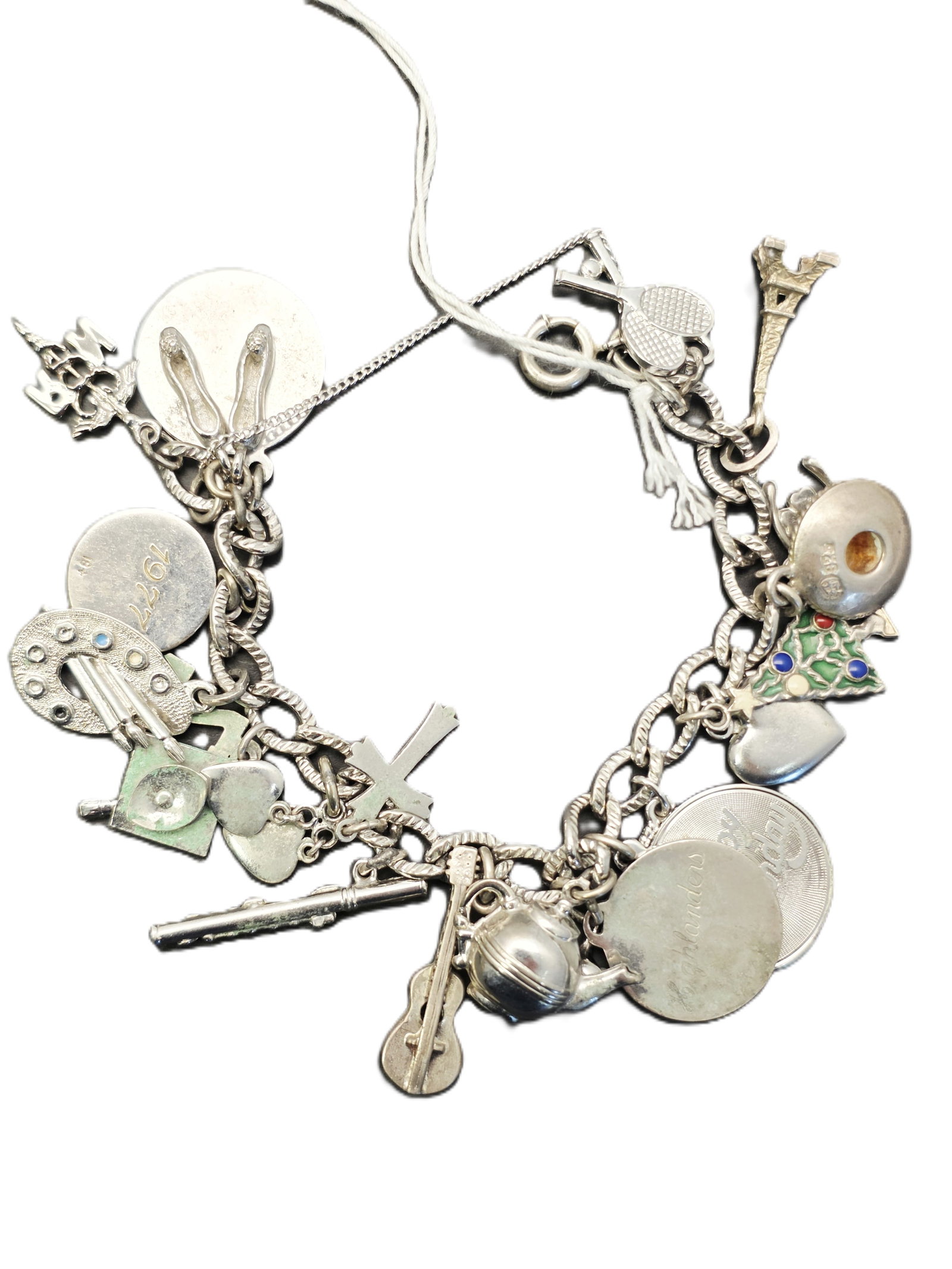 vintage silver charm bracelet featuring various miniature charms: vintage silver charm bracelet featuring various miniature charms. Many of them are sterling