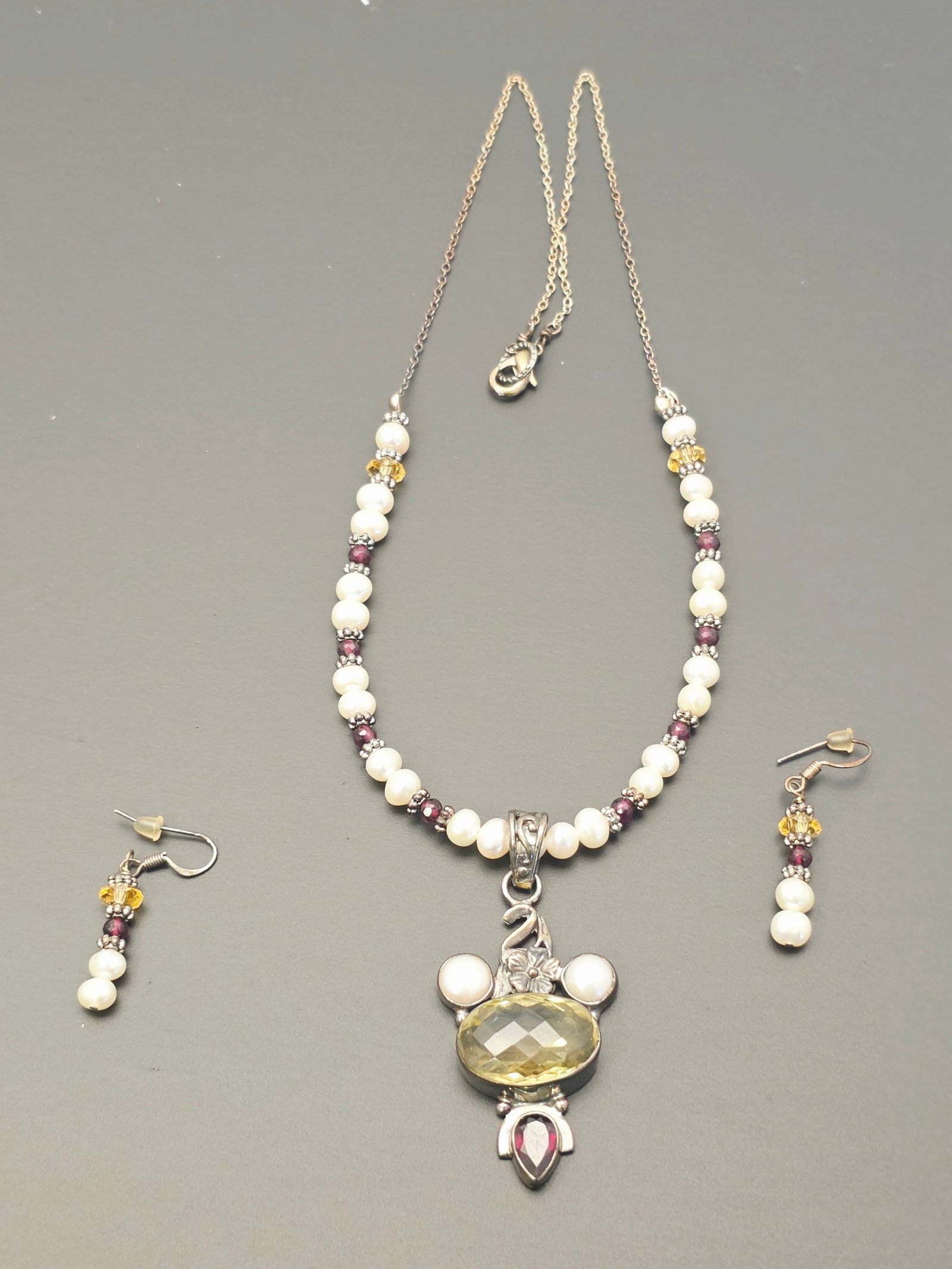 necklace with a sterling pendant and matching earrings: necklace featuring a sterling faceted citrine pendant accented with garnet and pearls