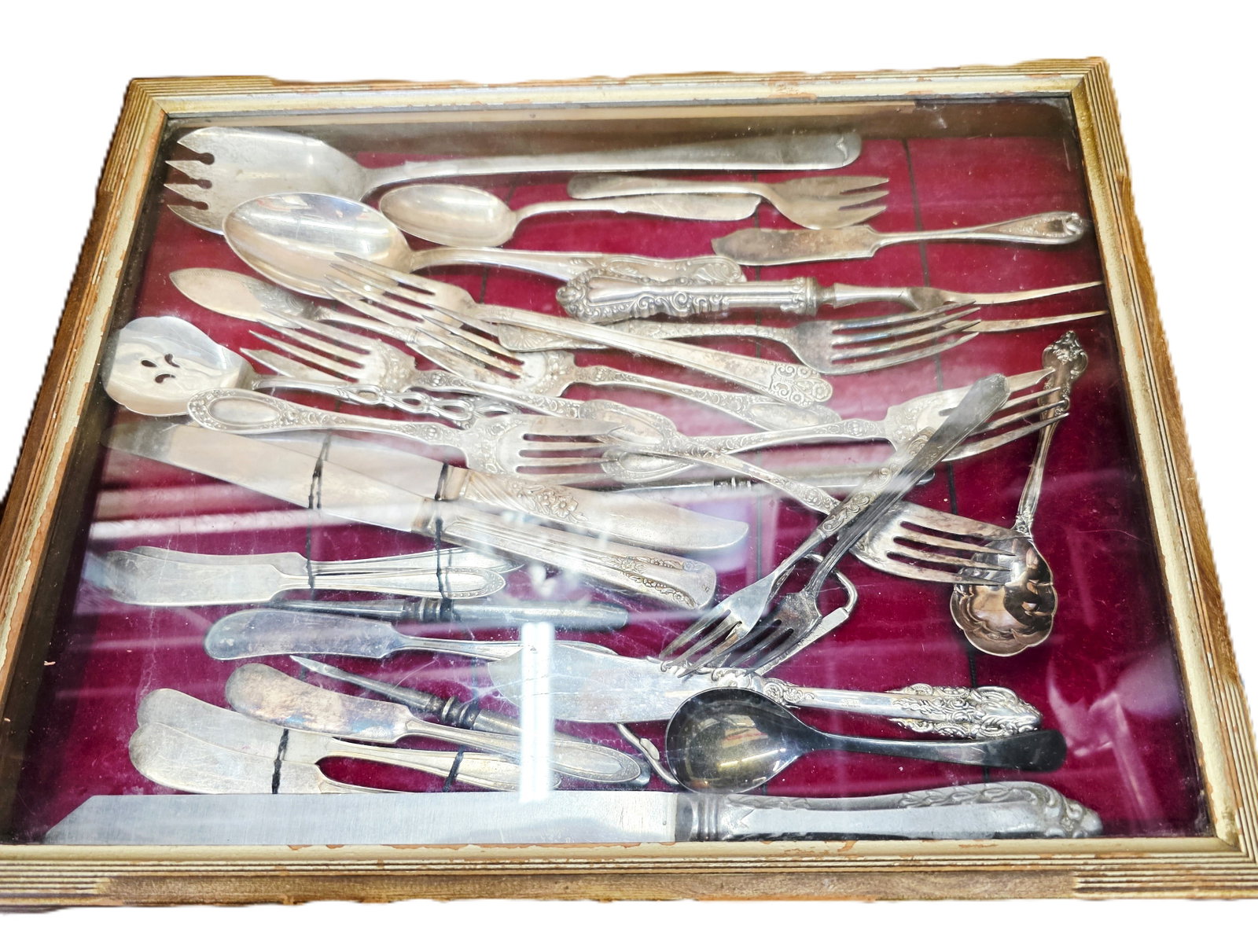 Antique shadowbox filled with silver plate utensils (1 of 20)