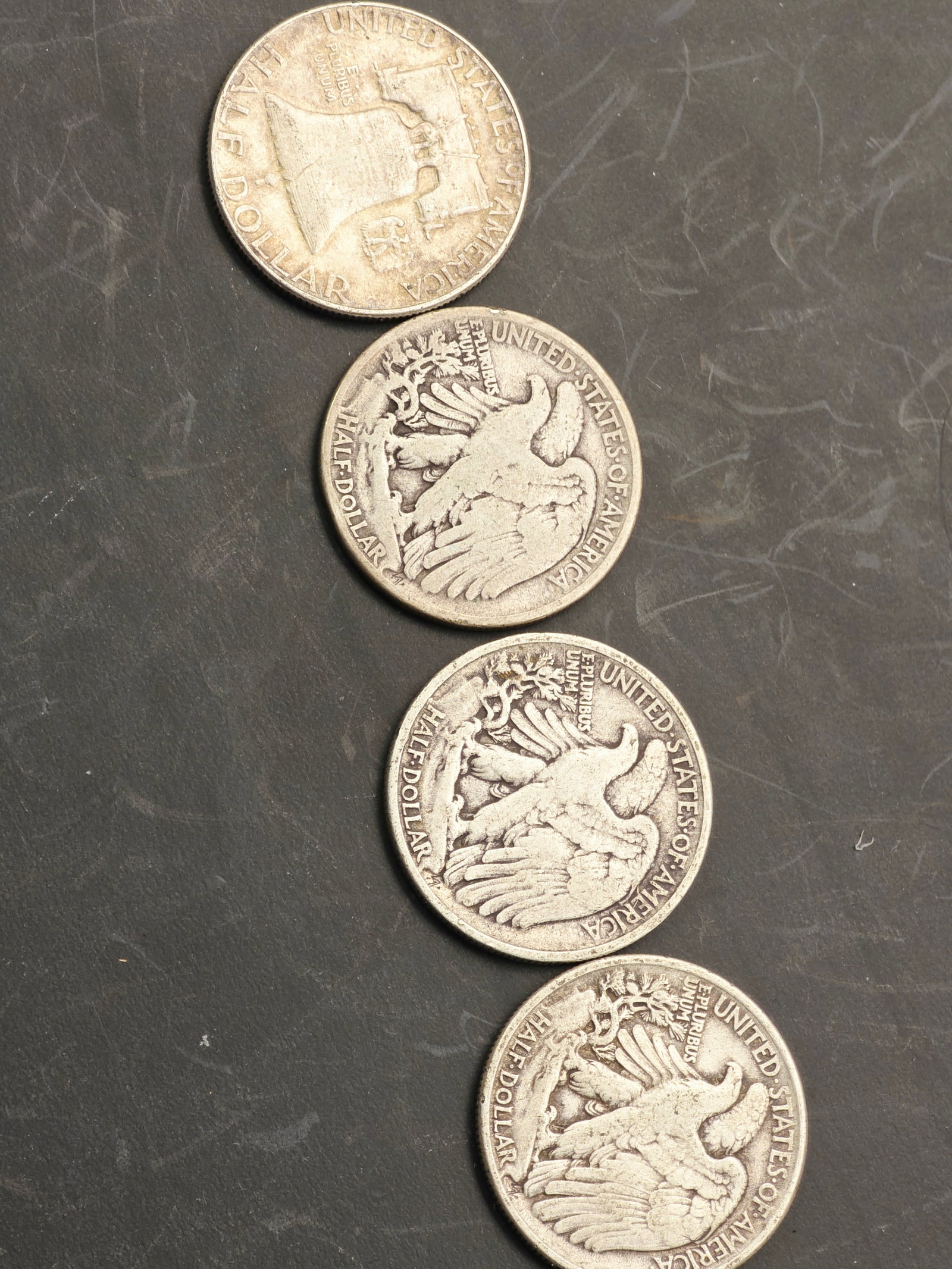 90% silver One Franklin dollar and 3 Walking Liberty Half Dollars: One Franklin dollar and Walking Liberty Half Dollars, which were minted by the United States Mint from 1916 to 1947.Silver Content: These coins are composed of Walking Liberty Half Dollars, which