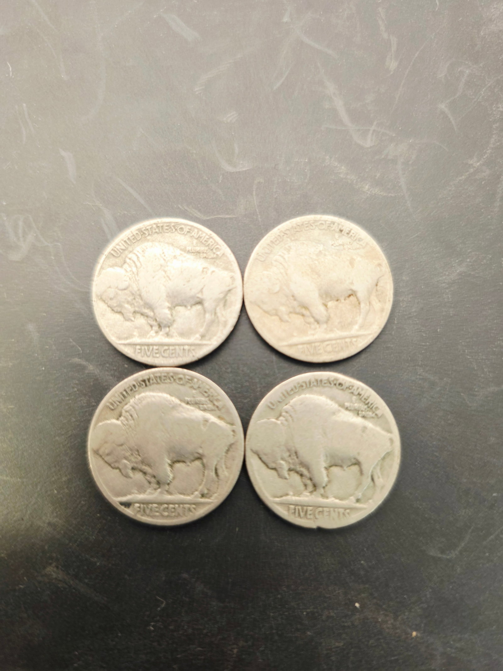 4 vintage Buffalo nickels, which were originally minted between 1913 and 1938: These items are vintage Buffalo nickels, which were originally minted between 1913 and 1938.Design Details: The coins feature an American bison (buffalo) on the reverse and a Native American profile