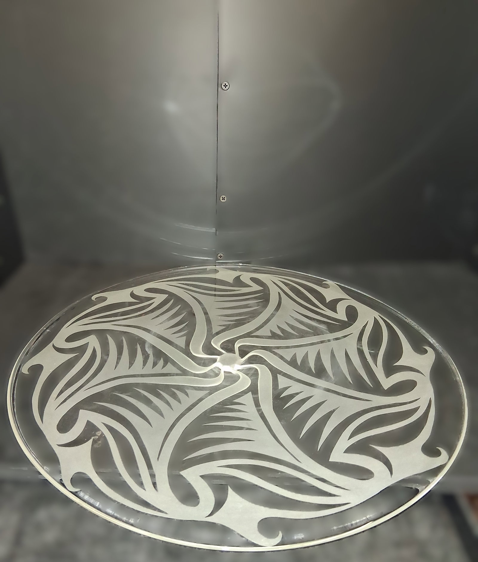 circular glass platter with an engraved abstract pattern, signed: signed, a circular glass platter with an engraved abstract pattern
