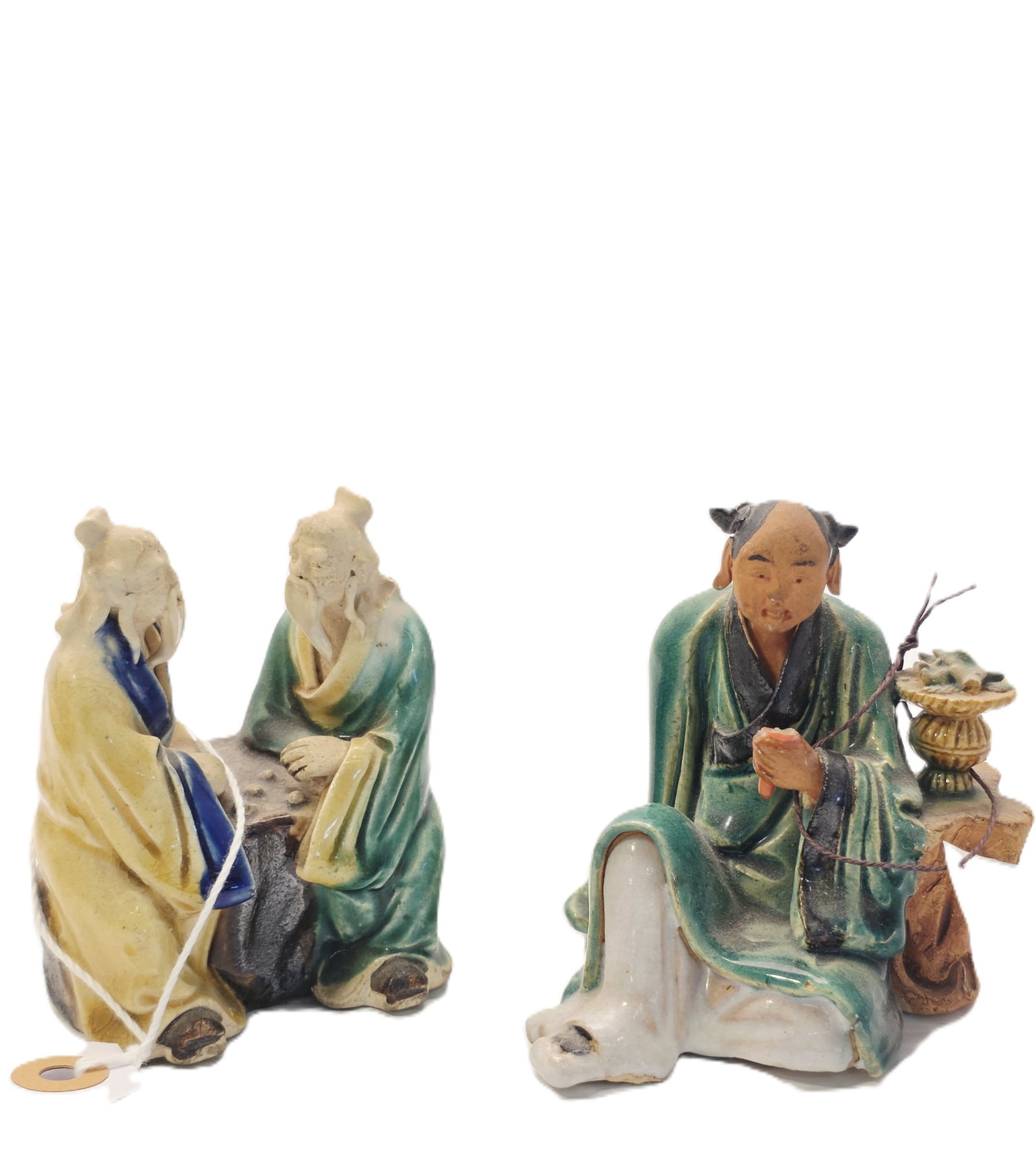 Two Antique Shiwan Pottery Mudman Figurines: Shiwan pottery Mudman figure likely dating from the late 19th to early 20th century.Materials and Style: These figurines are hand-molded from clay and typically feature vibrant, low-temperature