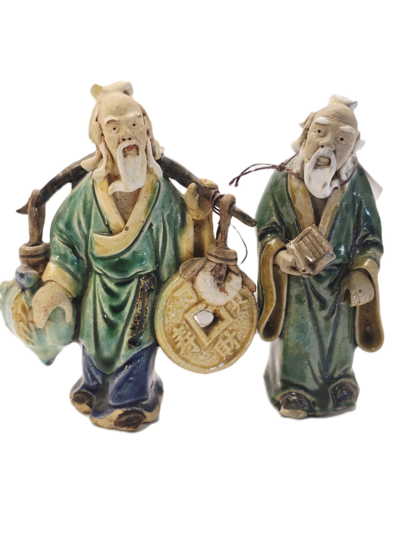 Two slightly larger Shiwan Pottery Mudman Figurines: Shiwan pottery Mudman figure likely dating from the late 19th to early 20th century.Materials and Style: These figurines are hand-molded from clay and typically feature vibrant, low-temperature