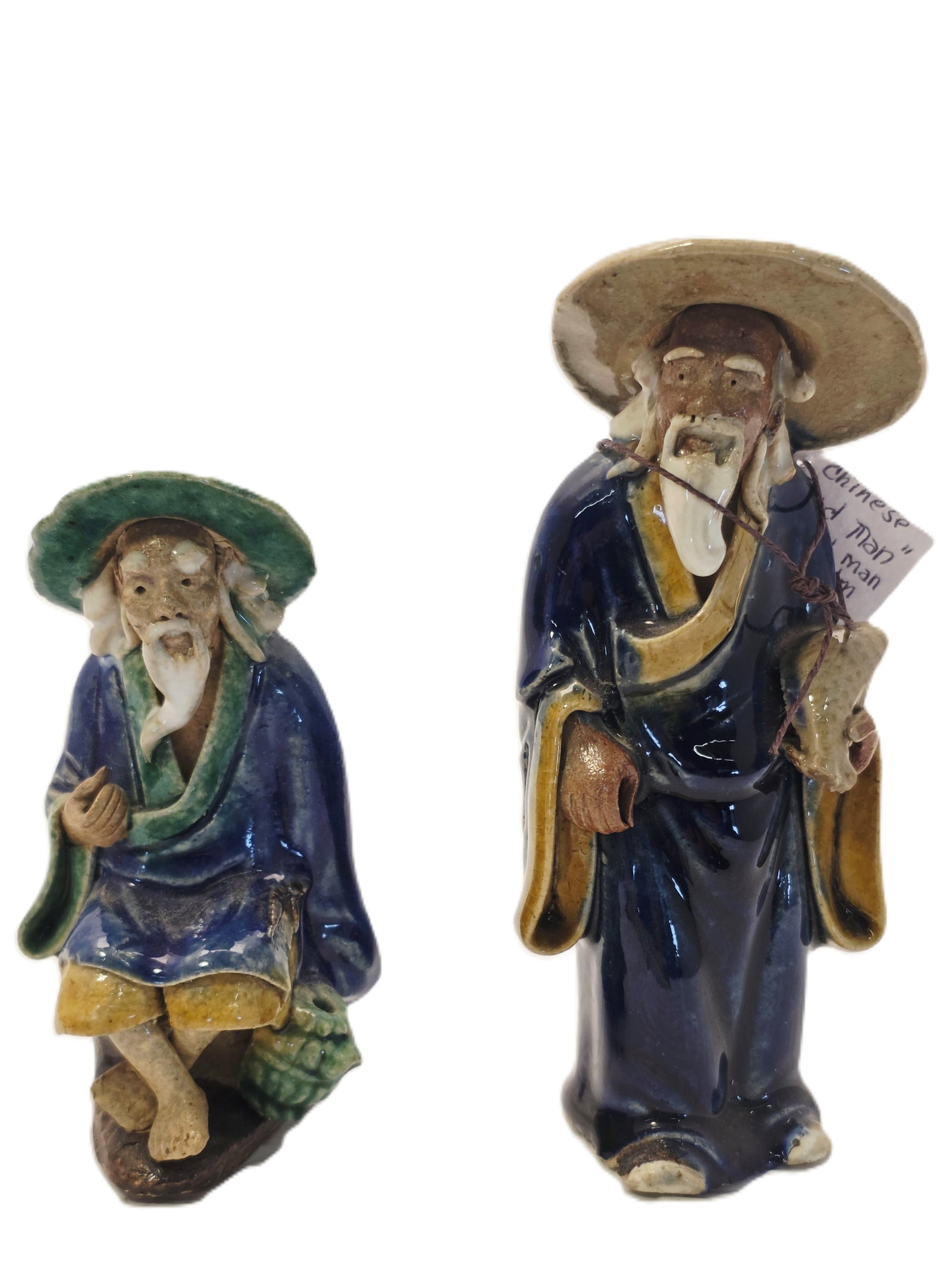 Two Shiwan Pottery Mudman Figurines: Shiwan pottery Mudman figure likely dating from the late 19th to early 20th century.Materials and Style: These figurines are hand-molded from clay and typically feature vibrant, low-temperature