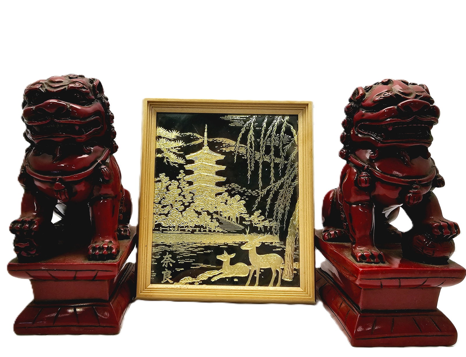 Two Foo Dogs And Japanese Gold Leaf Art: These are red resin Chinese Foo Dog guardian lion statues used in Feng Shui to bring luck and protection.Japanese gold leaf art piece depicting a pagoda in a light wood frame