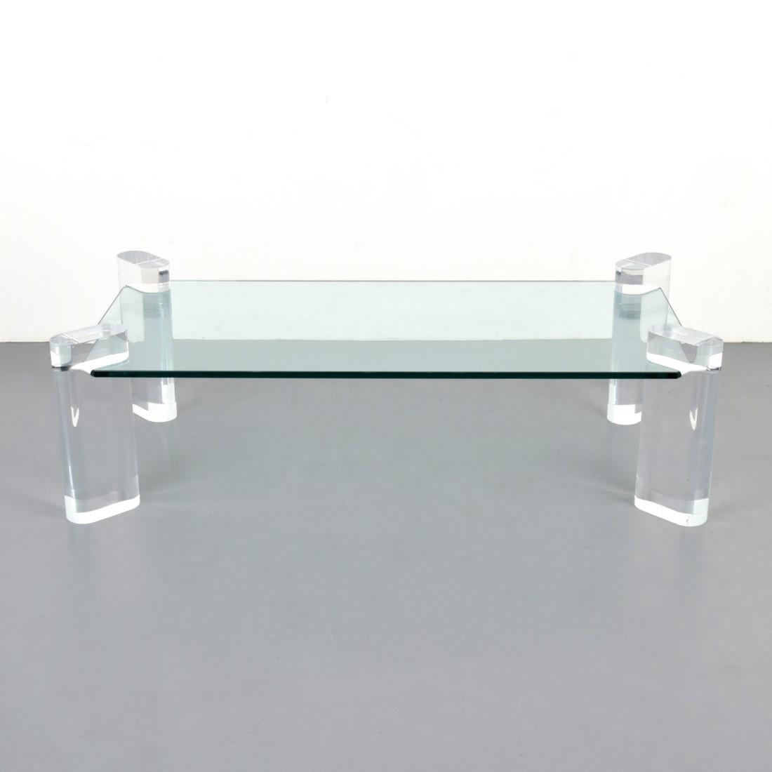 Large Karl Springer Coffee Table: Designer & Manufacturer: Karl Springer; Karl Springer Ltd. Markings: signed Country of Origin & Materials: USA; Lucite, glass Additional Information: Glass top is supported by four thick Lucite suppor