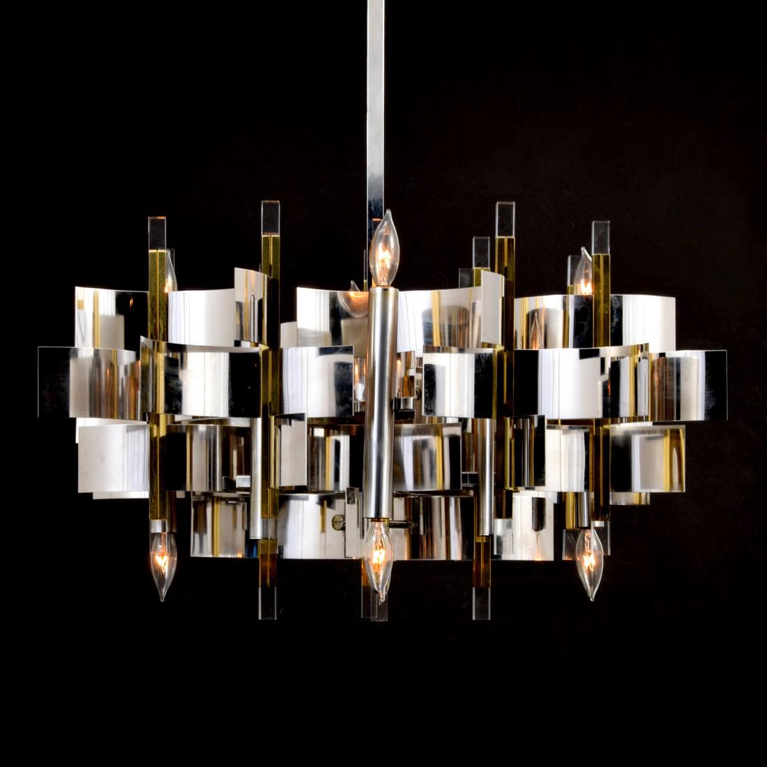 Large Gaetano Sciolari Chandelier: Designer & Manufacturer: Gaetano Sciolari Markings: Sciolari label Country of Origin & Materials: Italy; chromed metal, brass Additional Information: Chandelier has eight light sockets. Dimensions(H,W