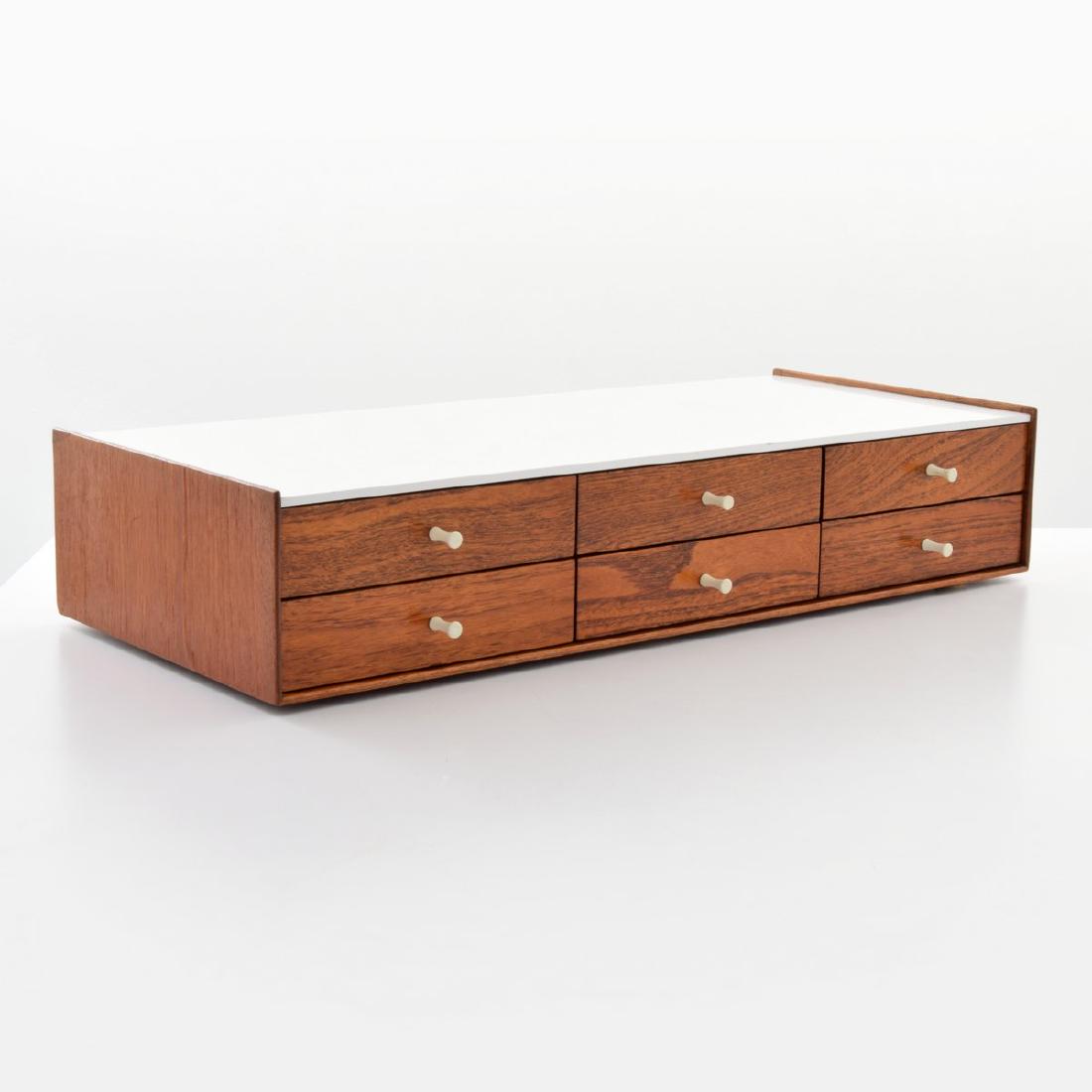 George Nelson & Assoc. Rosewood Jewelry Chest: Designer/Artist & Manufacturer: George Nelson & Associates; Herman Miller Markings: George Nelson/Herman Miller plaque, marking(s) Country of Origin & Materials: USA; rosewood, laminate, porcelain Add